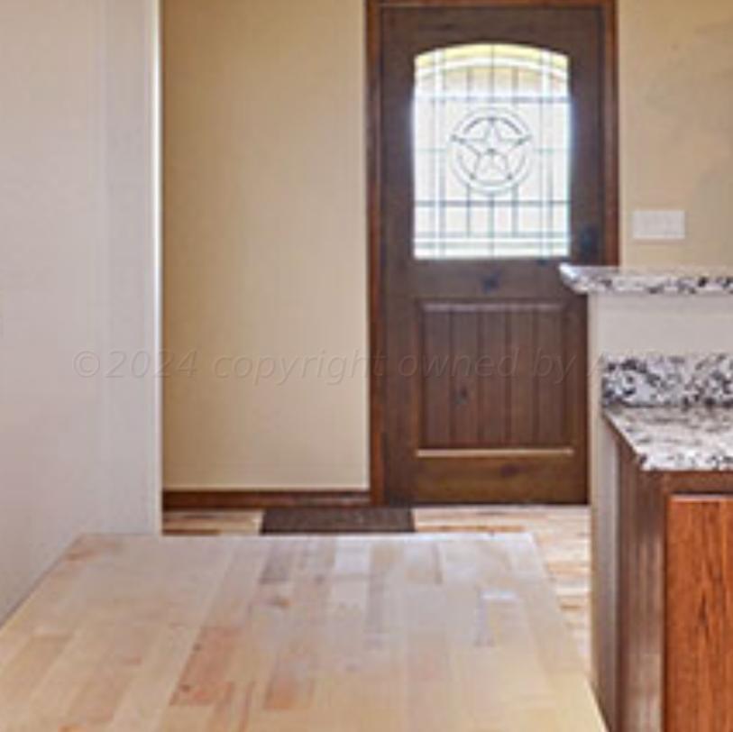 1159 Fm 1760 Muleshoe, TX 79347 - Photo 4 of 34 an empty room with wooden floor and windows