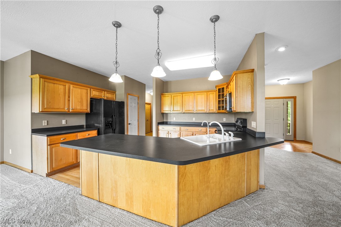 4840 Wayne Road Mantua, OH 44255 - Photo 12 of 42 Huge kitchen with hardwood floors, maple cabinetry and tons of counter space open to Great Room