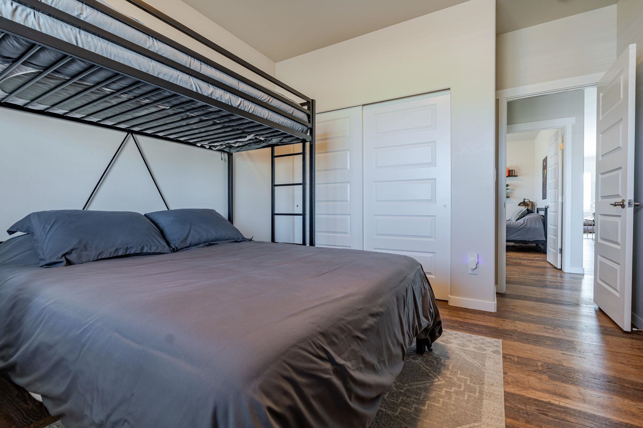 1301 M Road Loma, CO 81524 - Photo 26 of 32 a bedroom with a bed and a walk in closet