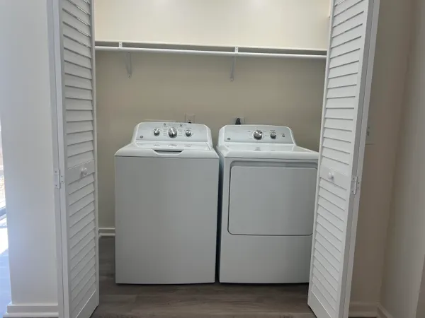 a utility room with dryer and washer