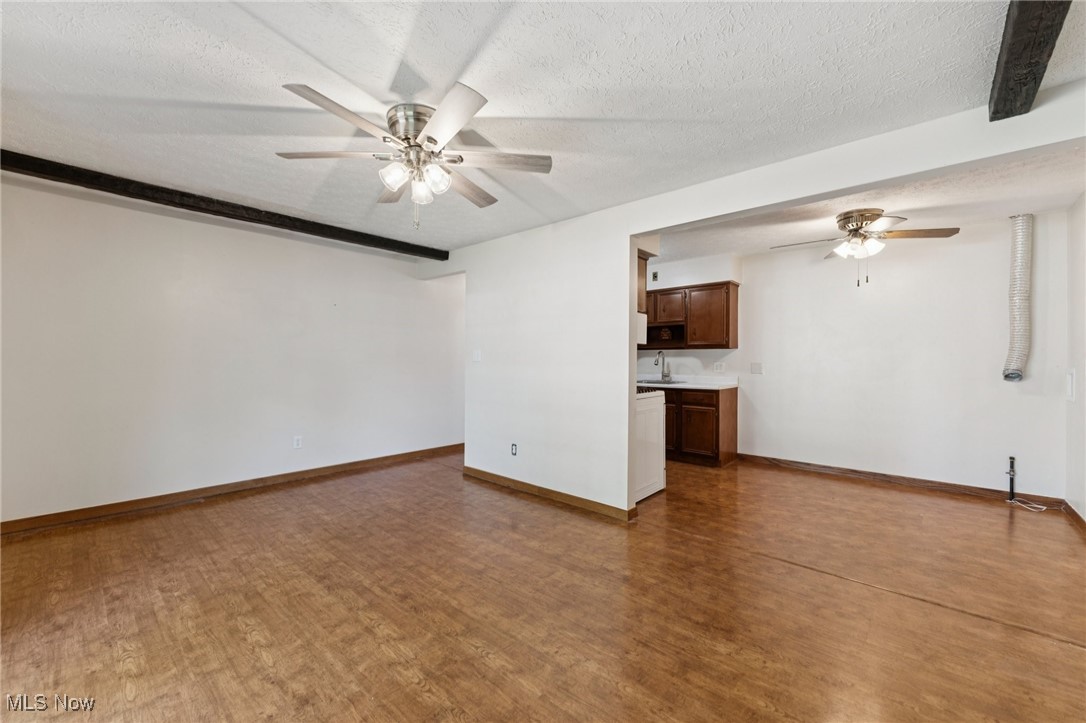 481 Meadowlane Road Independence, OH 44131 - Photo 27 of 40 Living room of inlaw is spacious. Note Laminate flooring throughout.