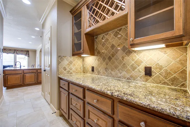 a view of a kitchen with a sink and cabinets