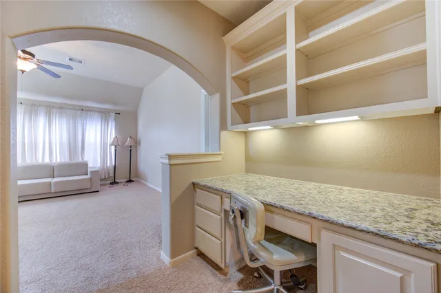 a view of washer and dryer with kitchen in the background