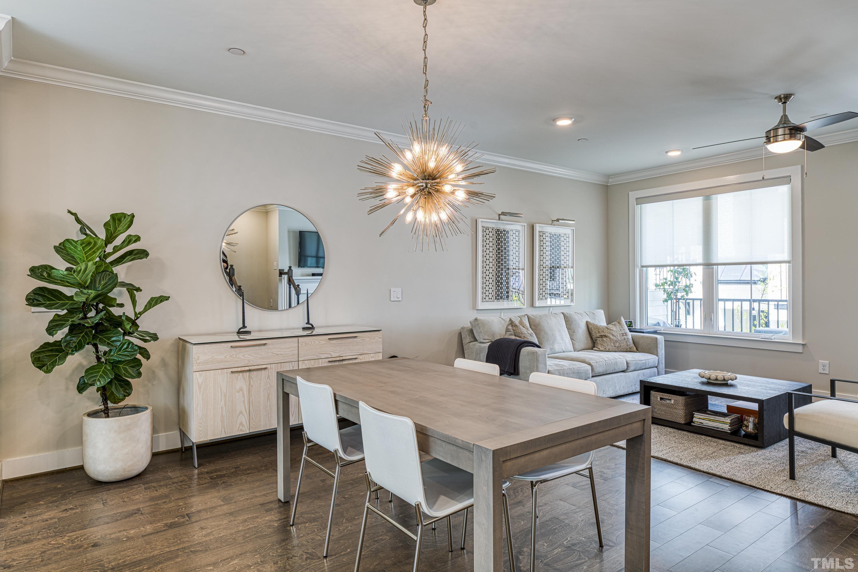401 Bryan Pointe Drive, Unit 103 Raleigh, NC 27608 - Photo 16 of 33 a view of a dining room with furniture window and wooden floor