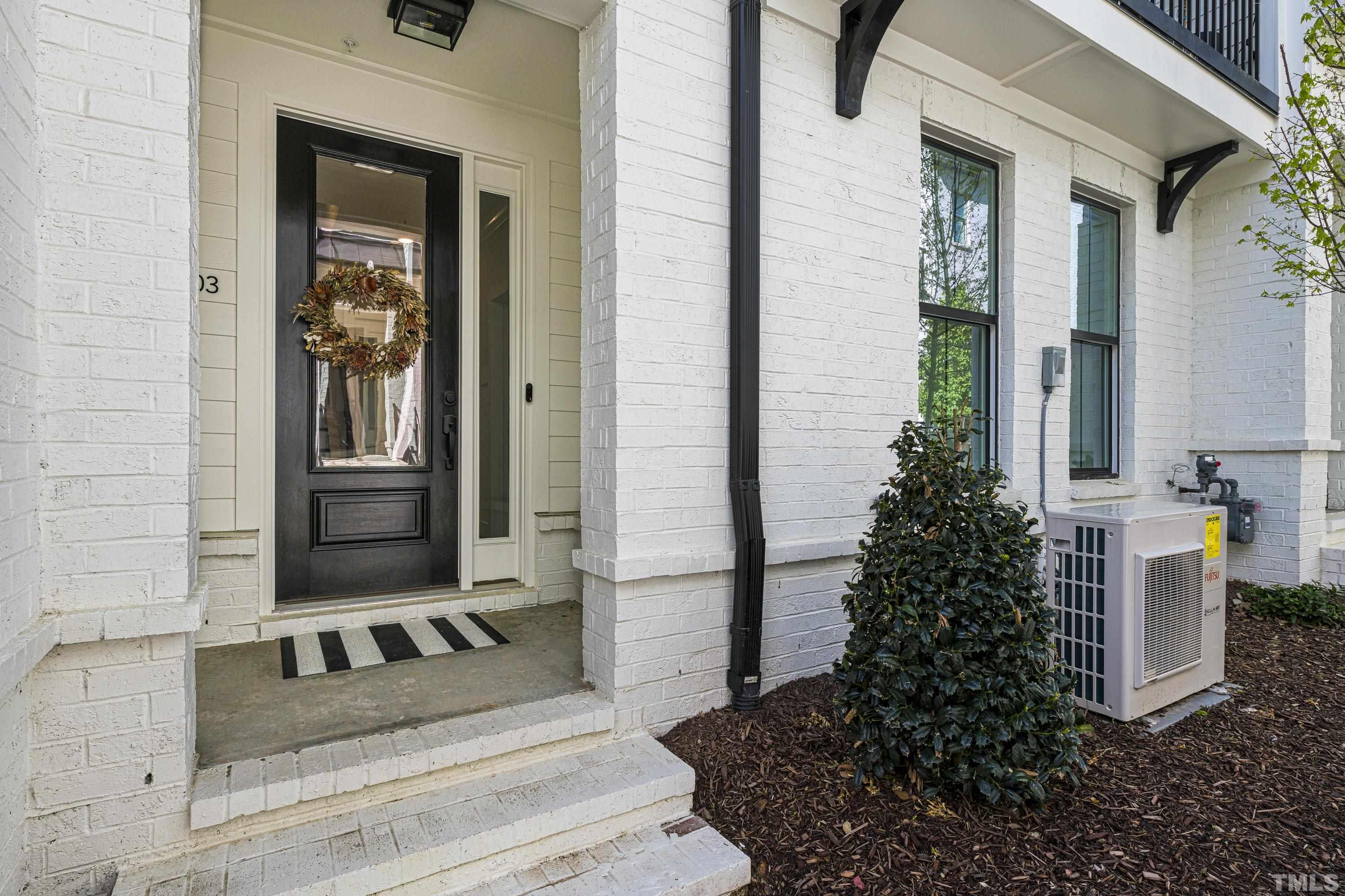 401 Bryan Pointe Drive, Unit 103 Raleigh, NC 27608 - Photo 2 of 33 a view of a entryway door of the house