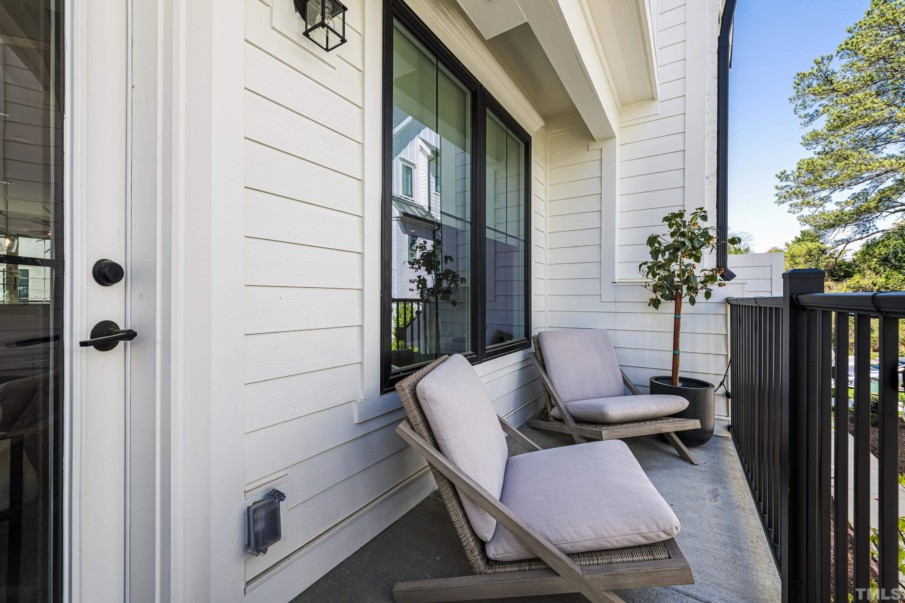 401 Bryan Pointe Drive, Unit 103 Raleigh, NC 27608 - Photo 22 of 33 a balcony view with a seating space