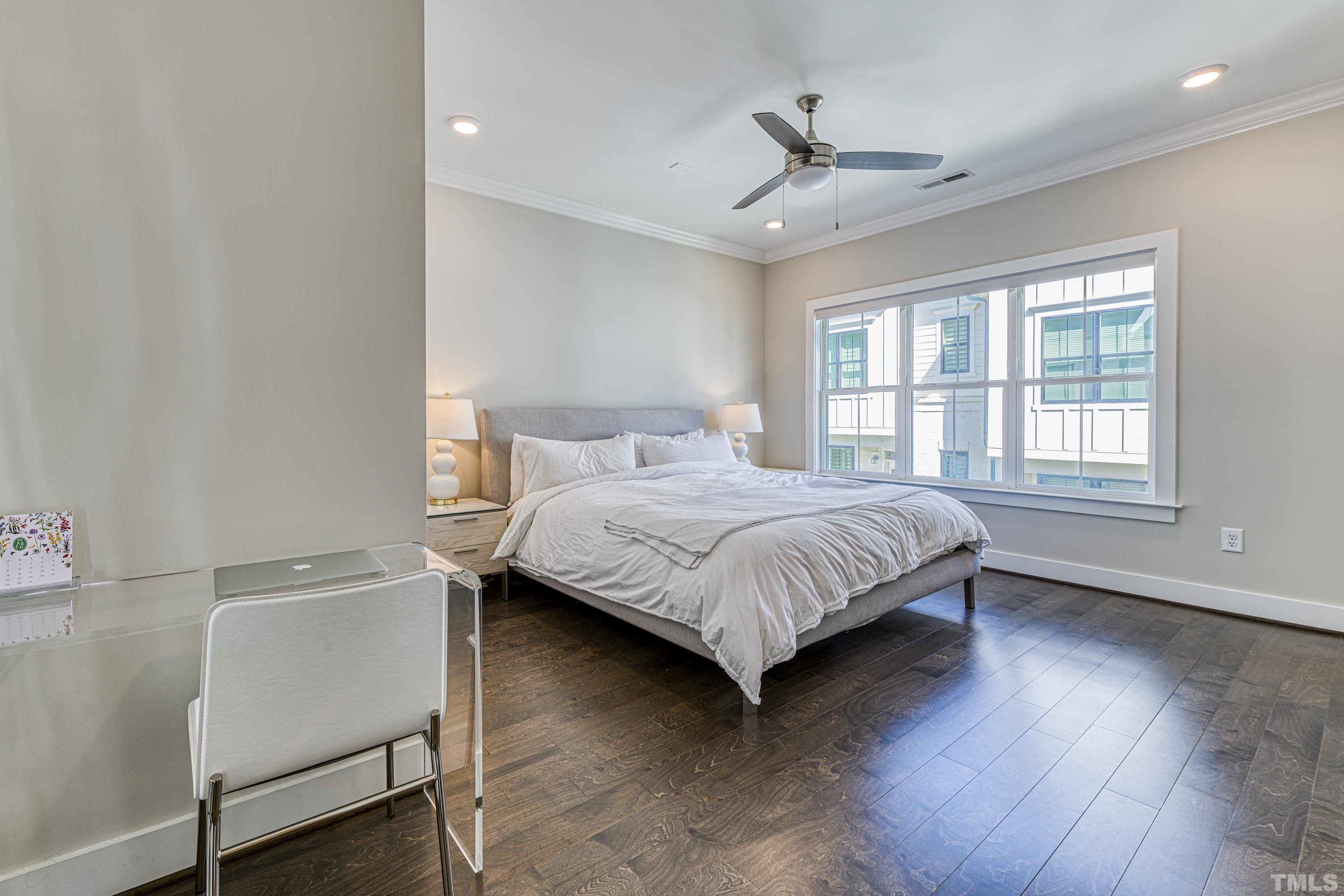 401 Bryan Pointe Drive, Unit 103 Raleigh, NC 27608 - Photo 24 of 33 a bedroom with a bed and a window