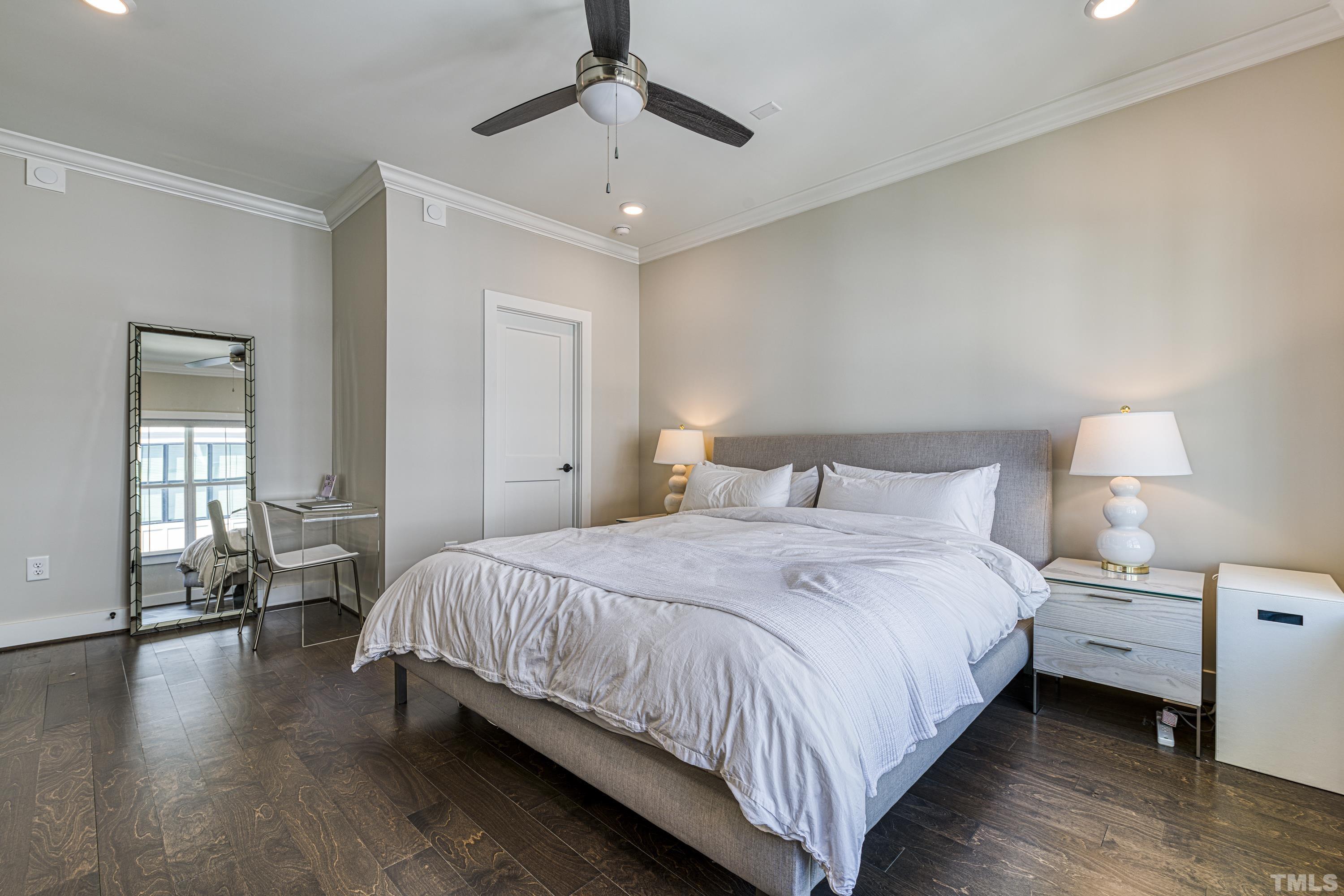 401 Bryan Pointe Drive, Unit 103 Raleigh, NC 27608 - Photo 25 of 33 a bedroom with bed and window