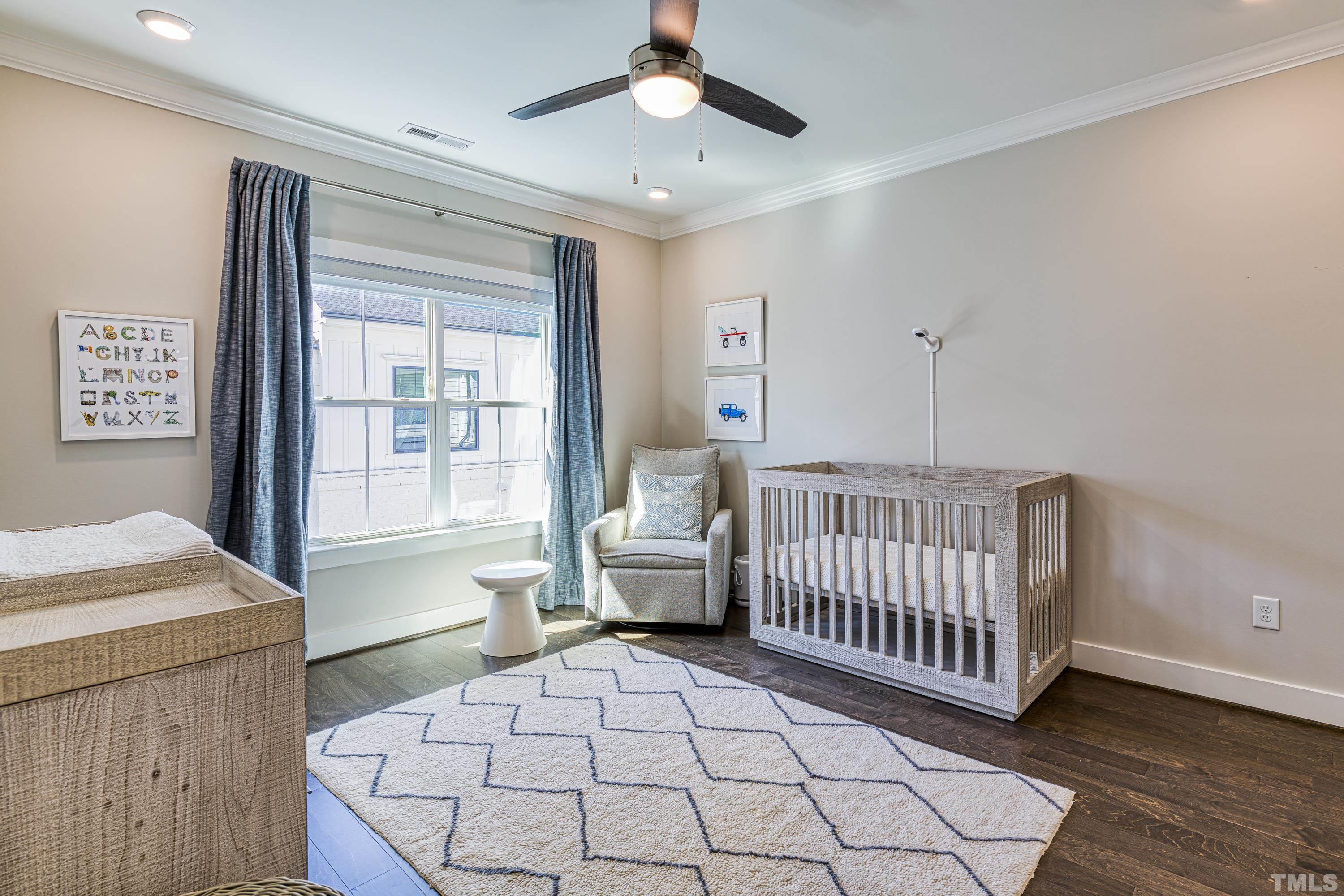 401 Bryan Pointe Drive, Unit 103 Raleigh, NC 27608 - Photo 29 of 33 a bedroom with furniture and windows