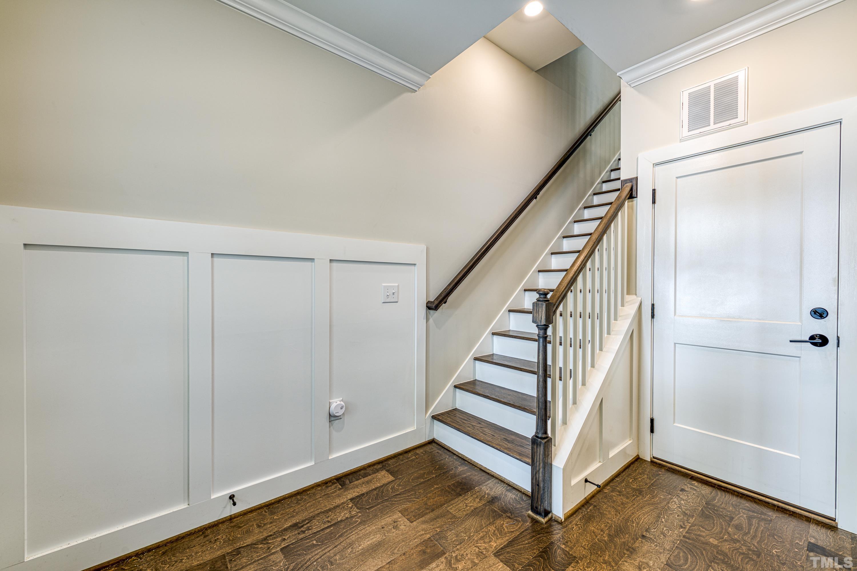 401 Bryan Pointe Drive, Unit 103 Raleigh, NC 27608 - Photo 3 of 33 a view of a hallway with staircase