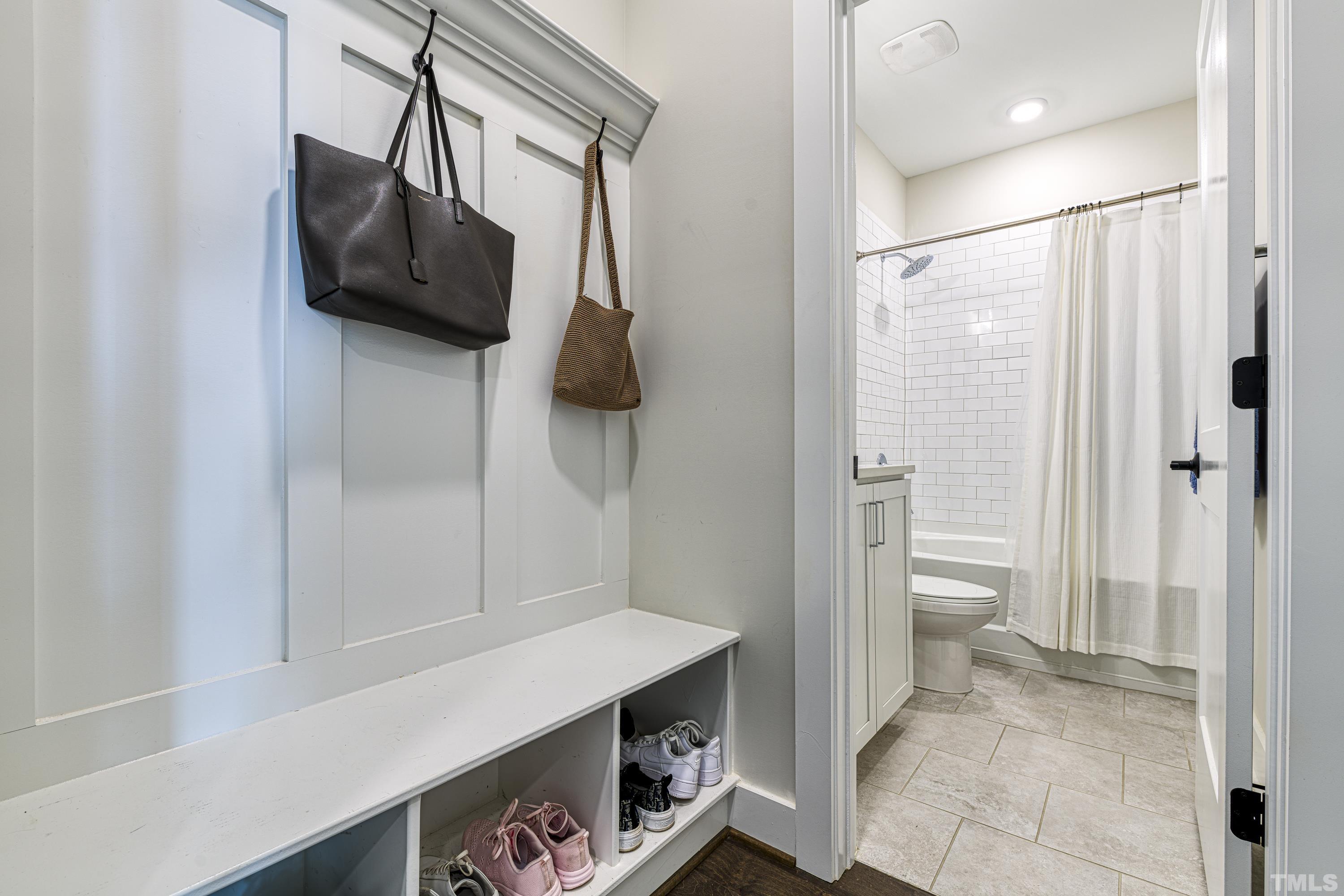 401 Bryan Pointe Drive, Unit 103 Raleigh, NC 27608 - Photo 7 of 33 a bathroom with a sink and a mirror