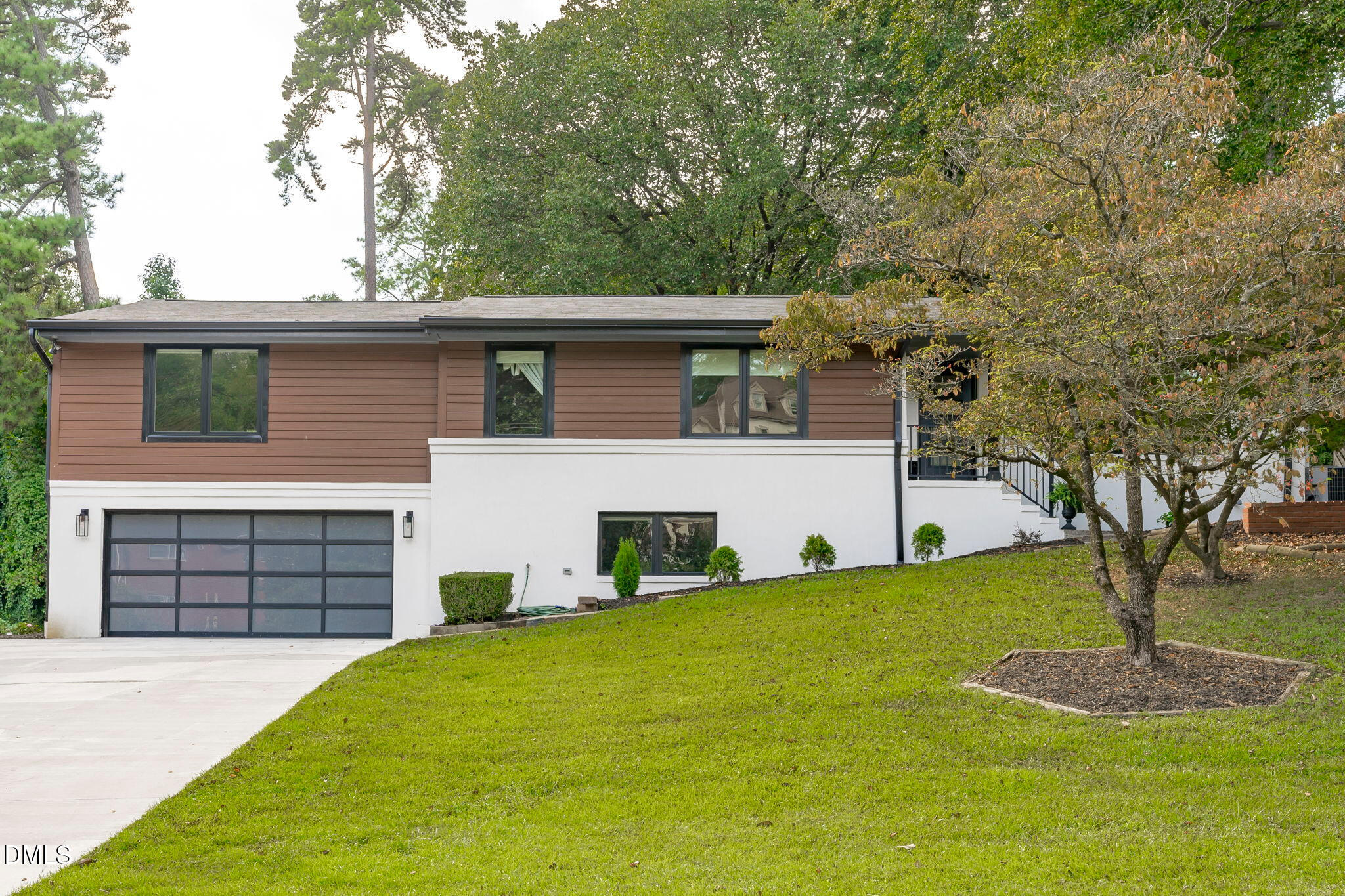 3513 Brook Drive Raleigh, NC 27609 - Photo 1 of 61 a front view of a house with a yard and garage