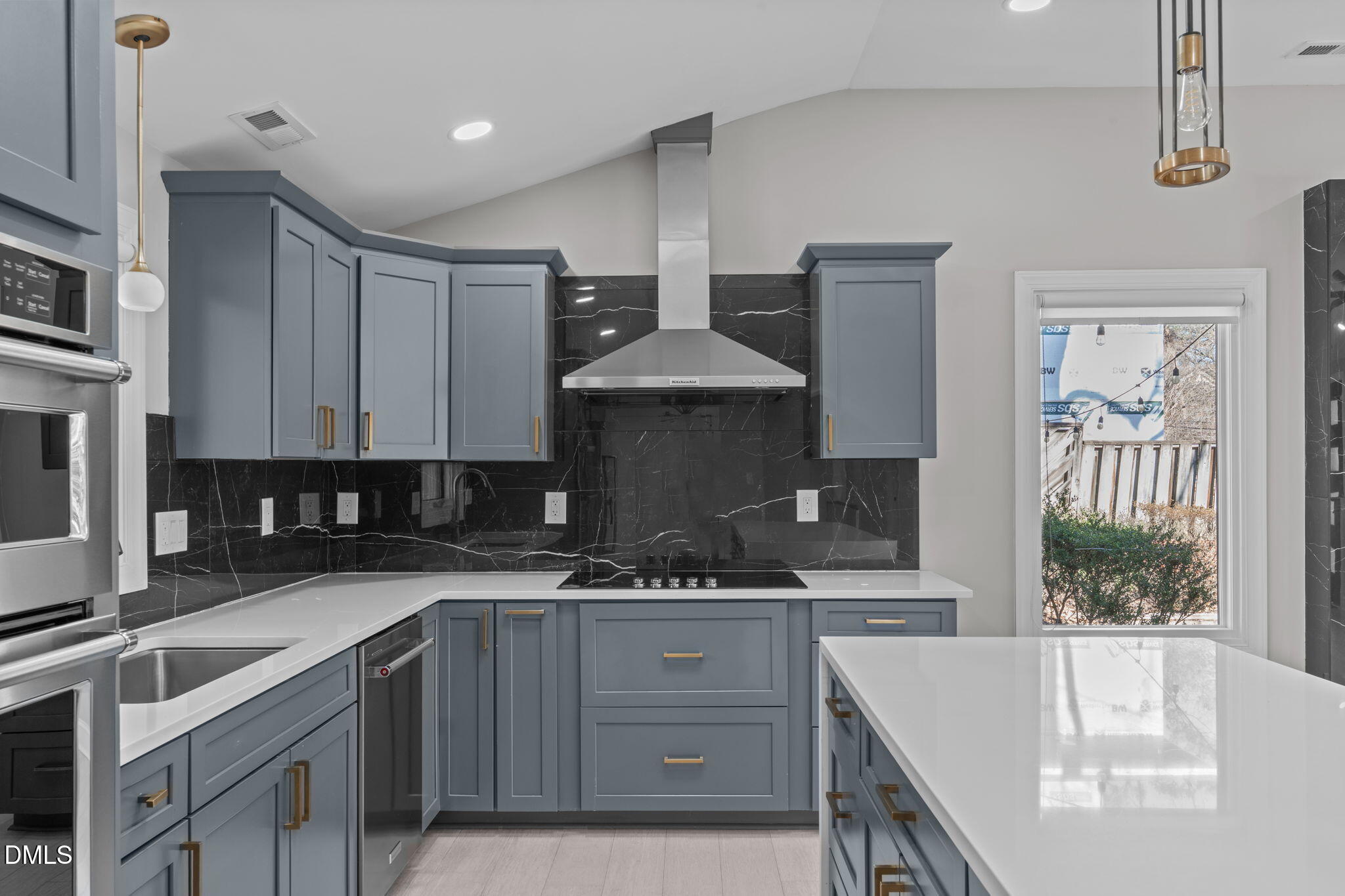 3513 Brook Drive Raleigh, NC 27609 - Photo 13 of 61 a kitchen with a sink cabinets and window