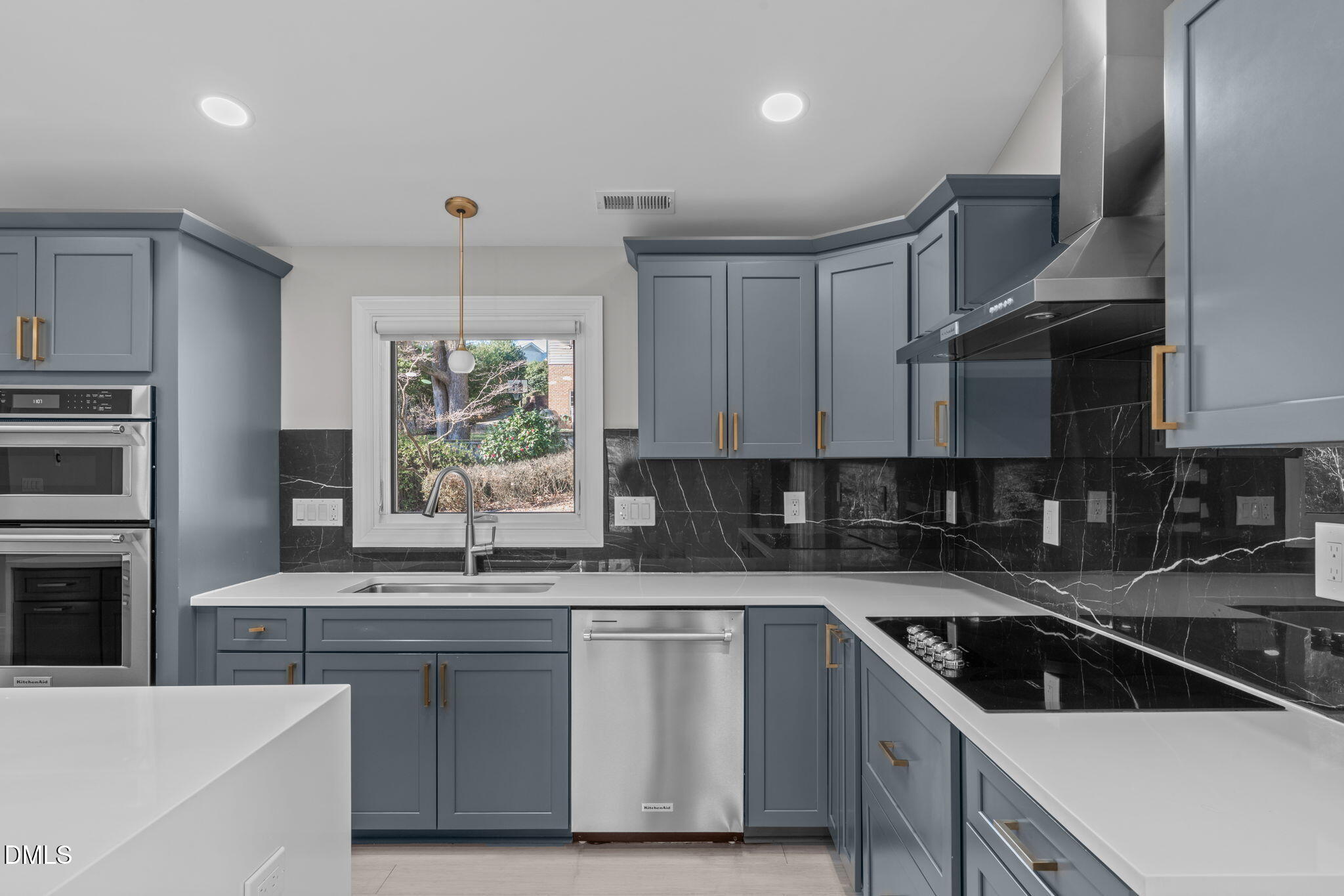 3513 Brook Drive Raleigh, NC 27609 - Photo 14 of 61 a kitchen with stainless steel appliances a sink stove and cabinets