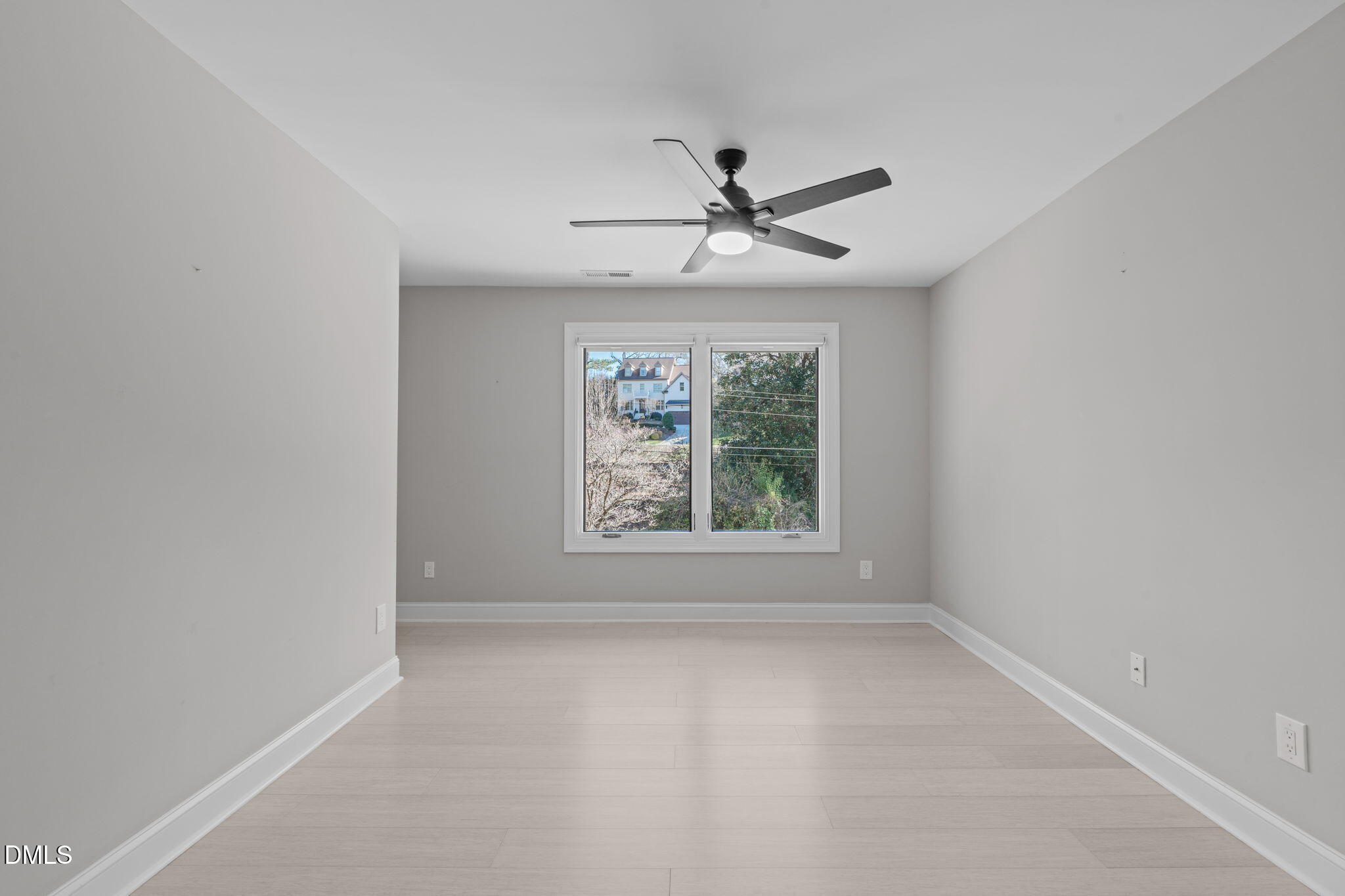 3513 Brook Drive Raleigh, NC 27609 - Photo 21 of 61 an empty room with a window and a fan