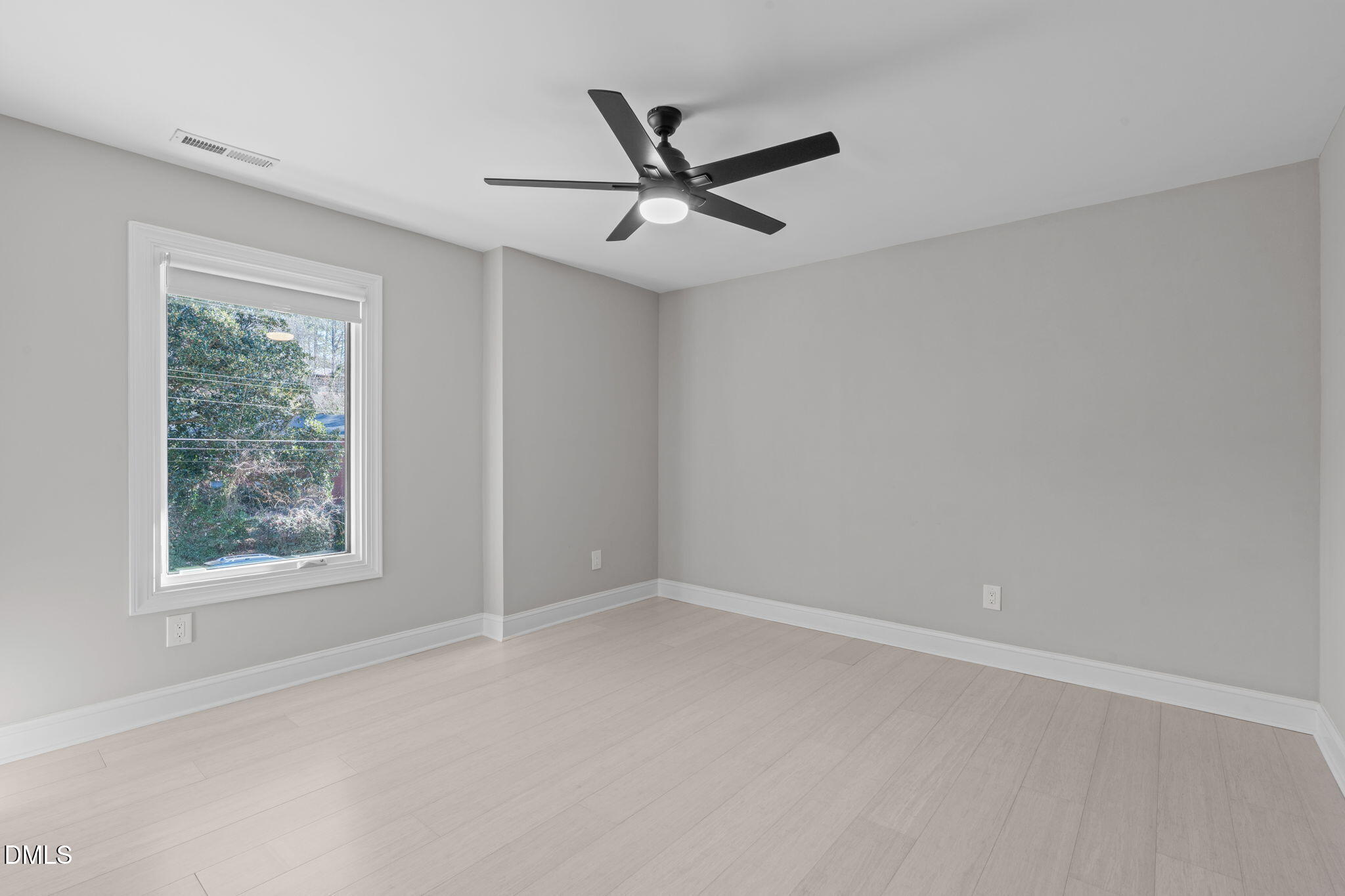 3513 Brook Drive Raleigh, NC 27609 - Photo 24 of 61 an empty room with a window and a fan