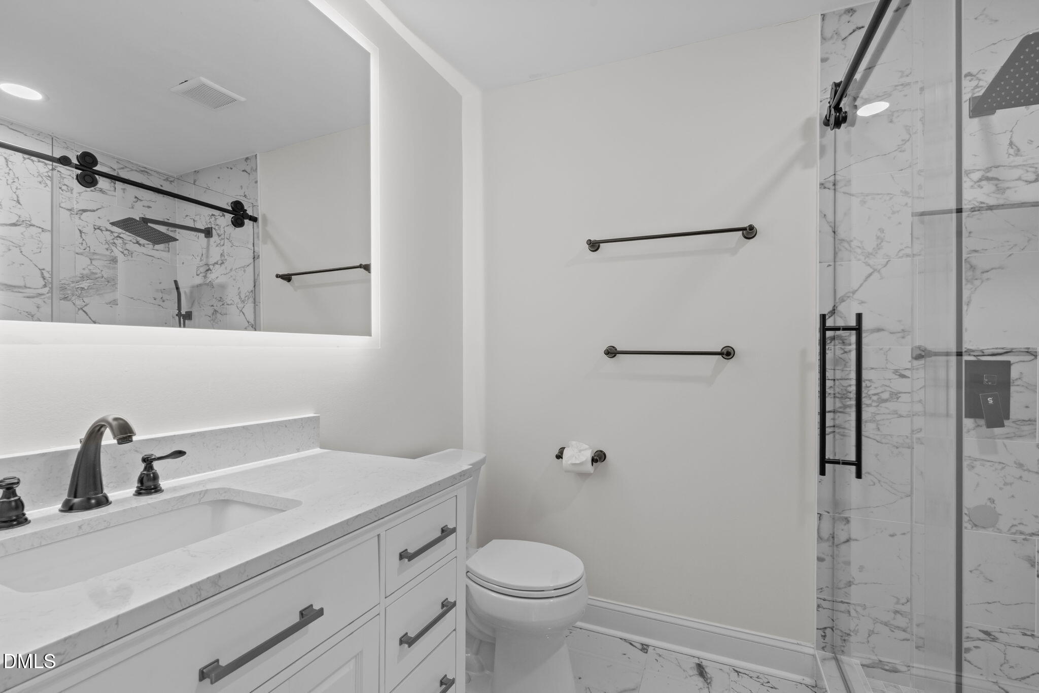 3513 Brook Drive Raleigh, NC 27609 - Photo 29 of 61 a bathroom with a sink a toilet and shower