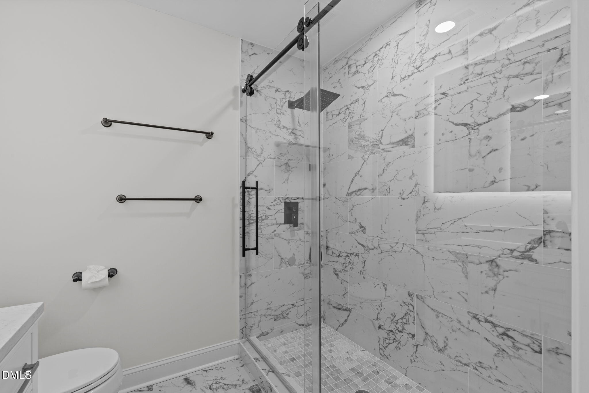 3513 Brook Drive Raleigh, NC 27609 - Photo 30 of 61 a bathroom with a shower toilet and sink