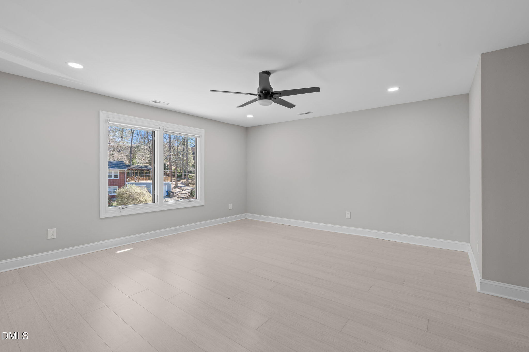 3513 Brook Drive Raleigh, NC 27609 - Photo 31 of 61 an empty room with windows and ceiling fan