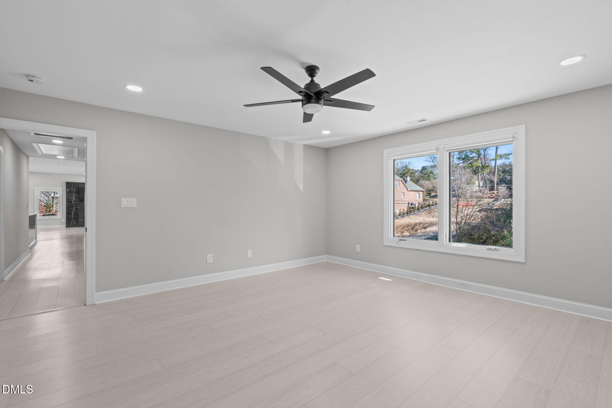 3513 Brook Drive Raleigh, NC 27609 - Photo 34 of 61 wooden floor in an empty room with a window