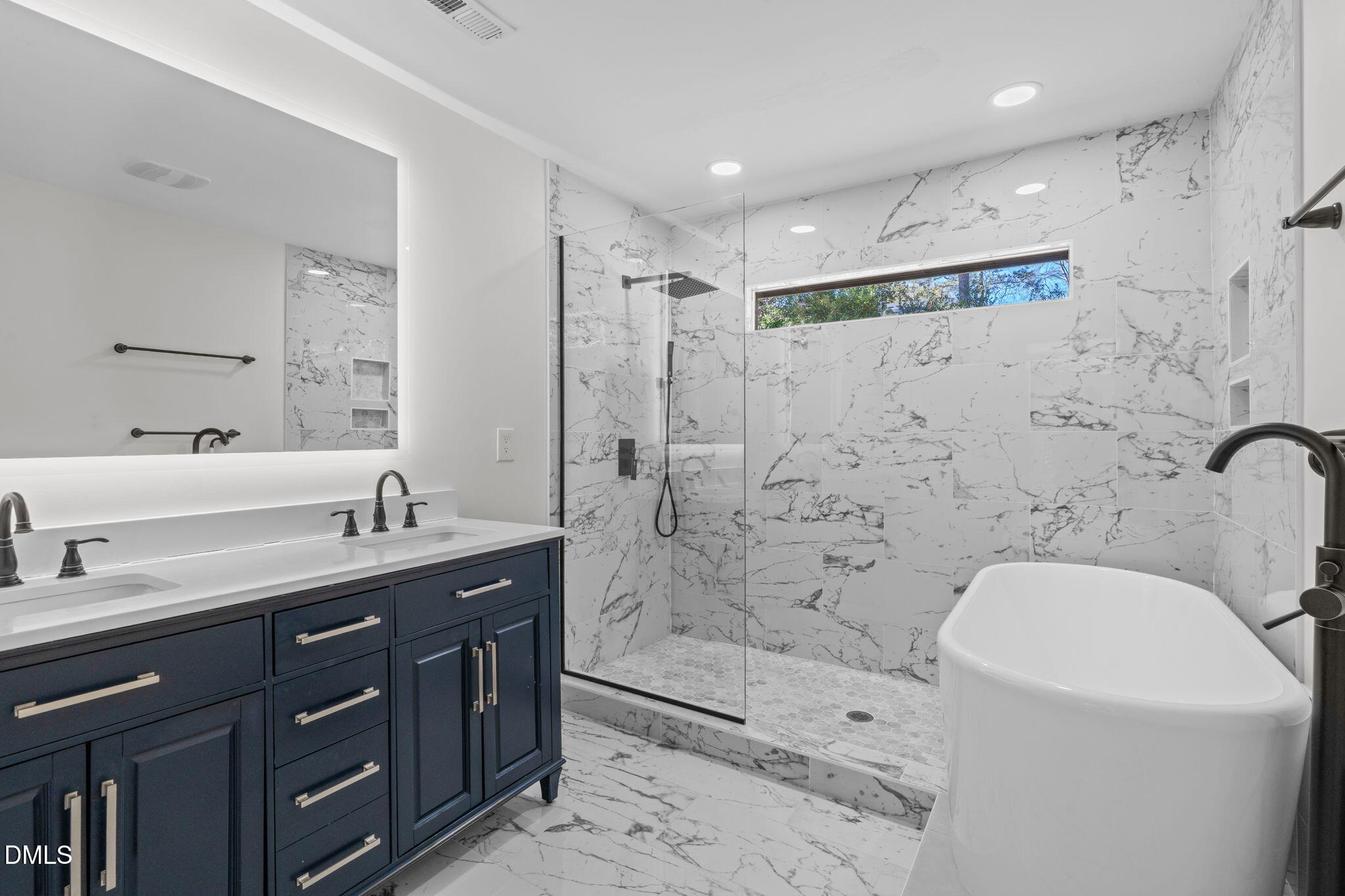 3513 Brook Drive Raleigh, NC 27609 - Photo 35 of 61 a bathroom with a granite countertop sink a toilet a mirror a bathtub and shower