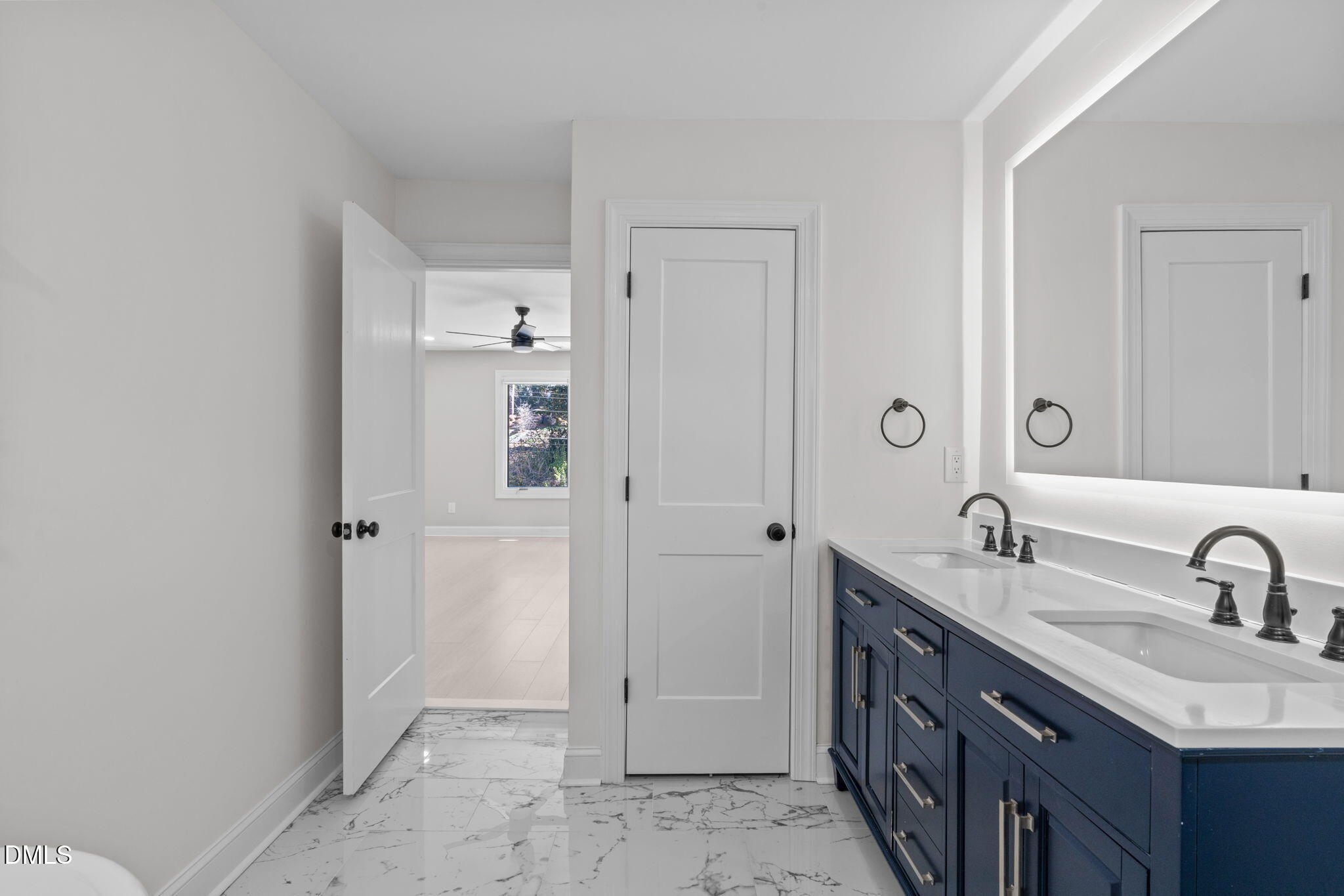 3513 Brook Drive Raleigh, NC 27609 - Photo 37 of 61 a bathroom with a double vanity sink and mirror
