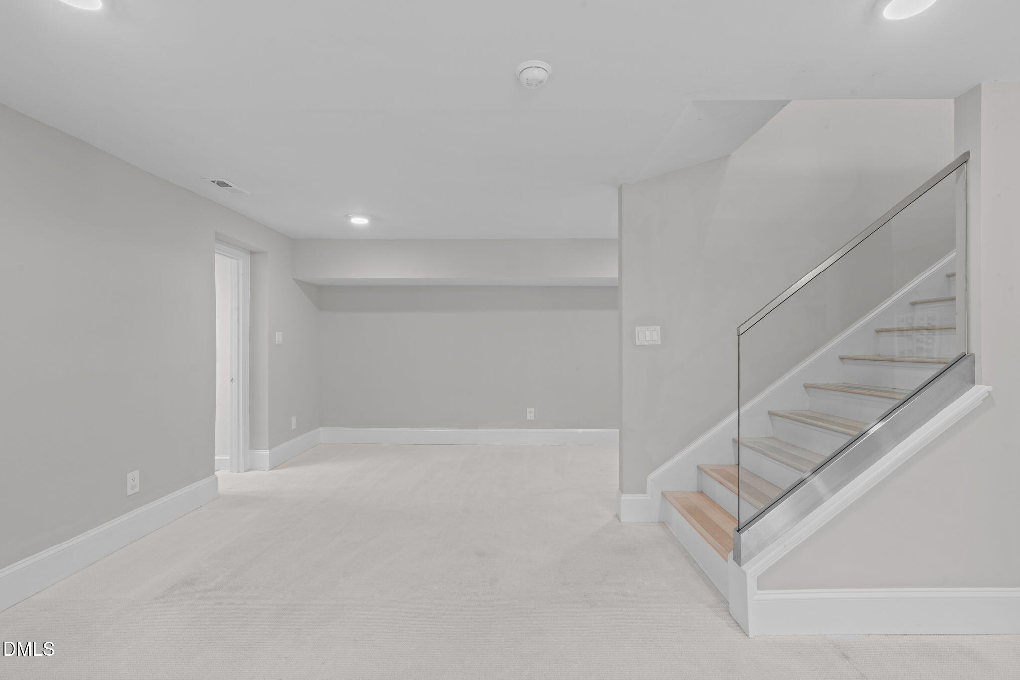 3513 Brook Drive Raleigh, NC 27609 - Photo 39 of 61 a view of an empty room with stairs