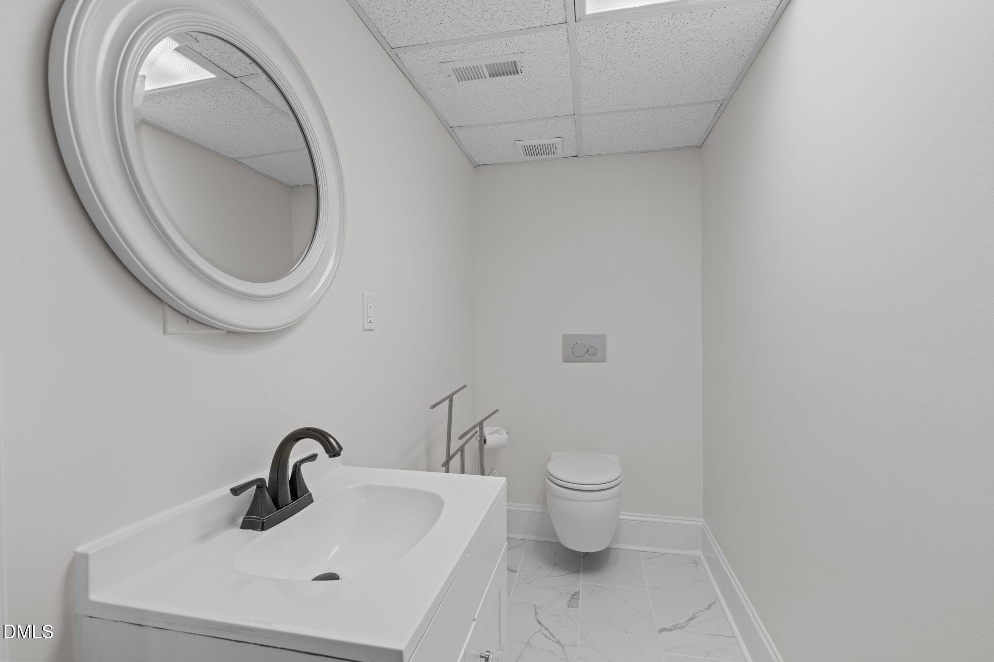 3513 Brook Drive Raleigh, NC 27609 - Photo 44 of 61 a bathroom with a toilet and a sink