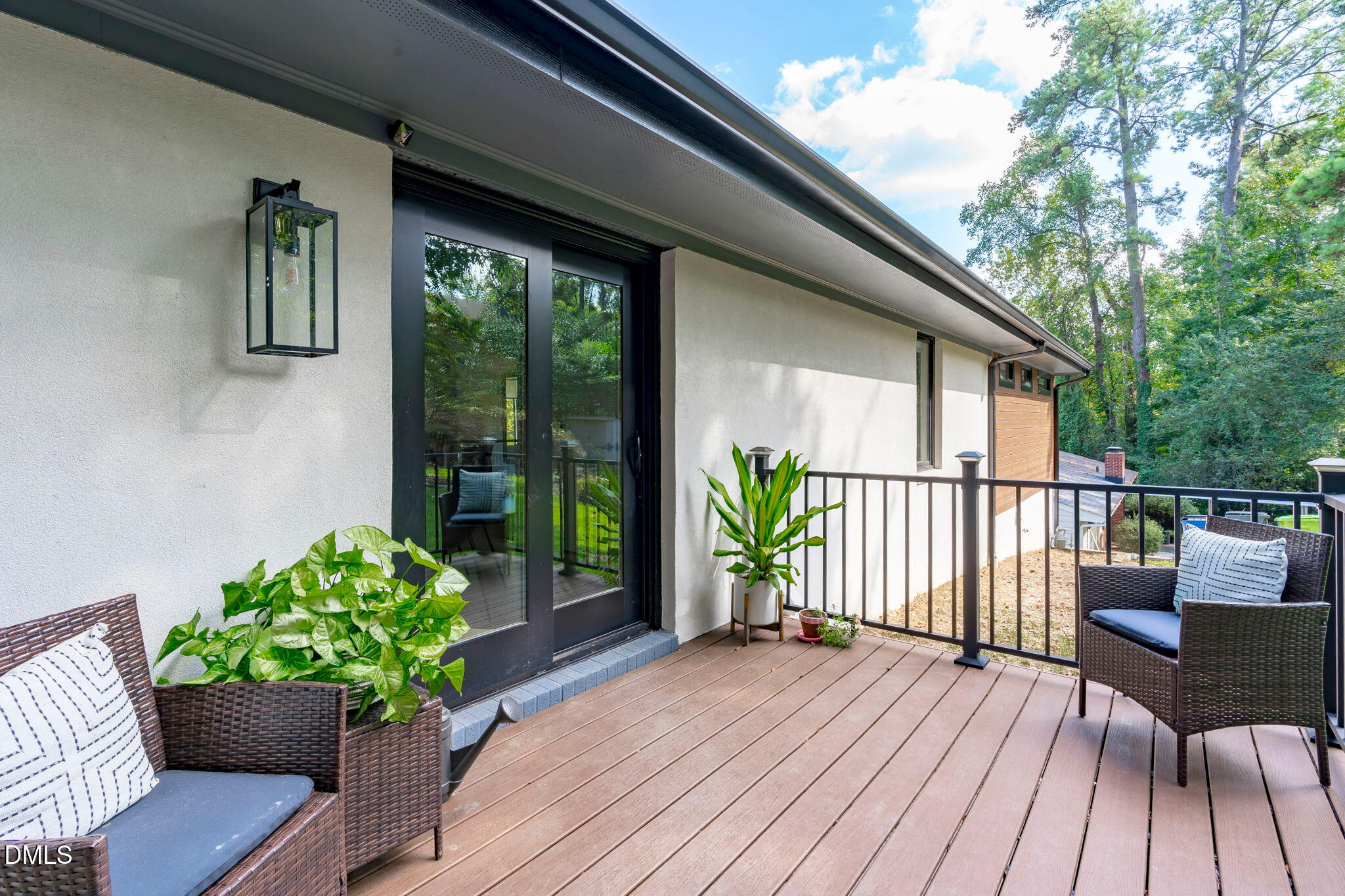 3513 Brook Drive Raleigh, NC 27609 - Photo 48 of 61 a balcony with wooden floor table and chairs