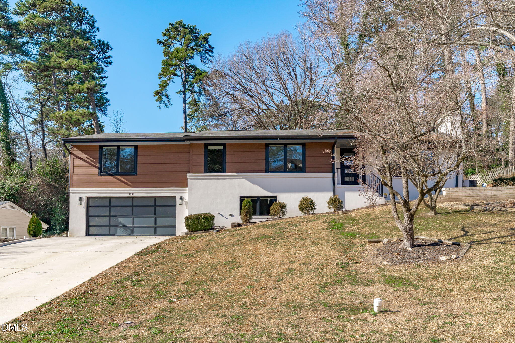 3513 Brook Drive Raleigh, NC 27609 - Photo 61 of 61 a front view of a house with a yard covered with snow