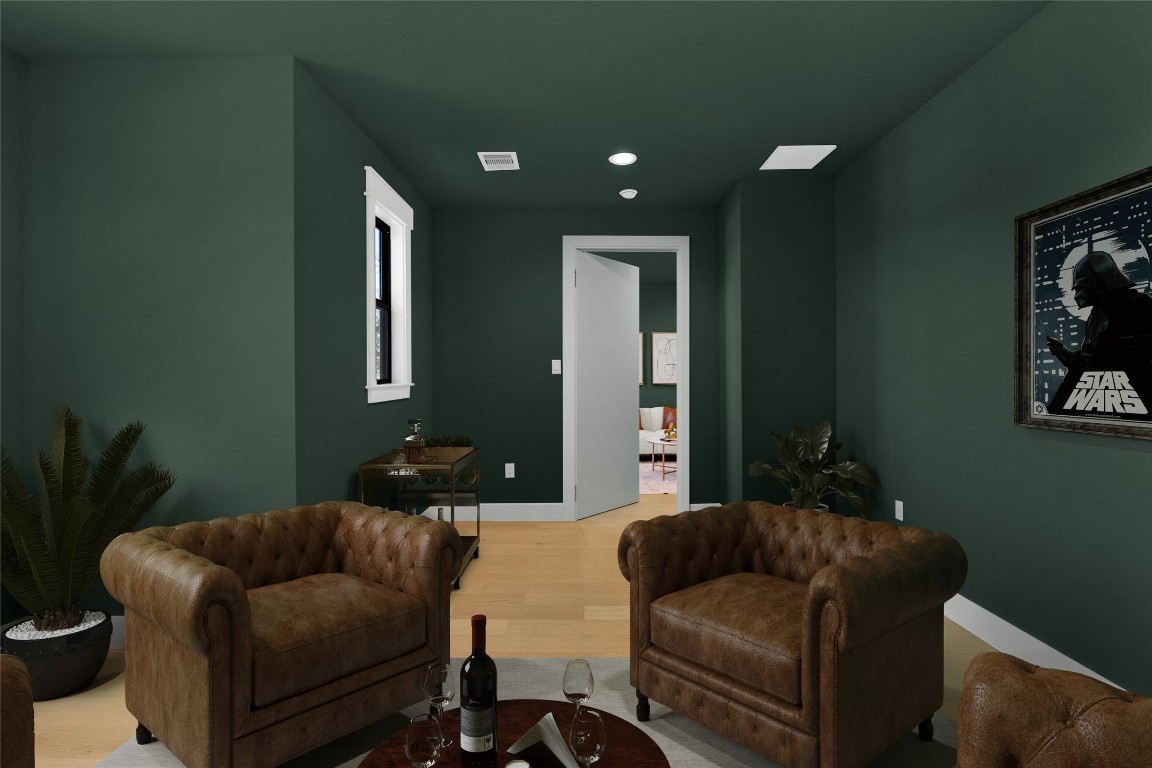 7115 Raton Street Houston, TX 77055 - Photo 21 of 49 This hidden speakeasy-style room is virtually staged as an intimate whiskey lounge, where deep tones, warm lighting, and plush seating create the perfect setting for slow evenings and good conversation. It’s the kind of space you retreat to—pour a drink, unwind, and enjoy a more private side of the home that feels intentionally tucked away.