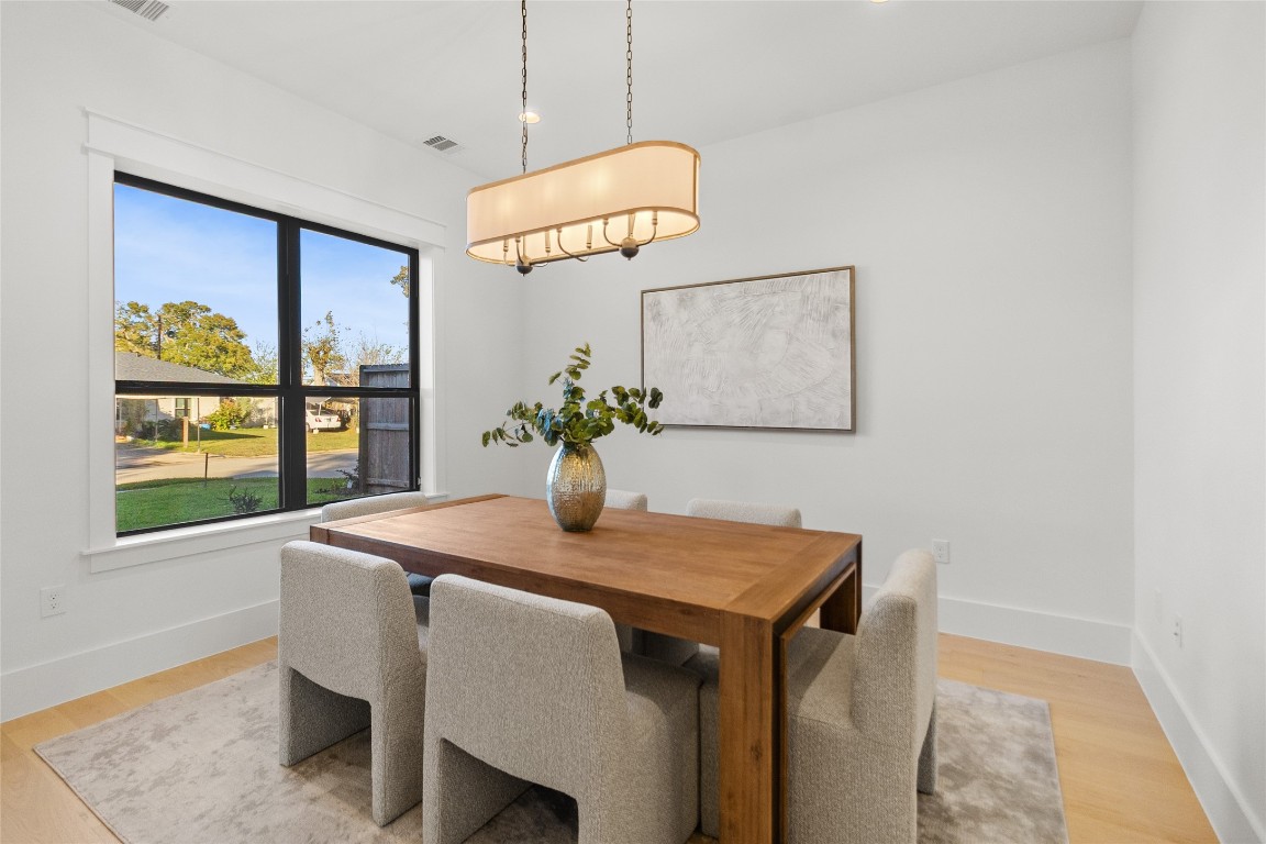 7115 Raton Street Houston, TX 77055 - Photo 28 of 49 This room works the way you need it to. Whether it’s your home office, creative studio, or quiet retreat, the layout gives you breathing room to focus without distractions. Natural light pours in through oversized windows, while the clean lines and warm flooring create a balanced space that feels productive by day and peaceful after hours.