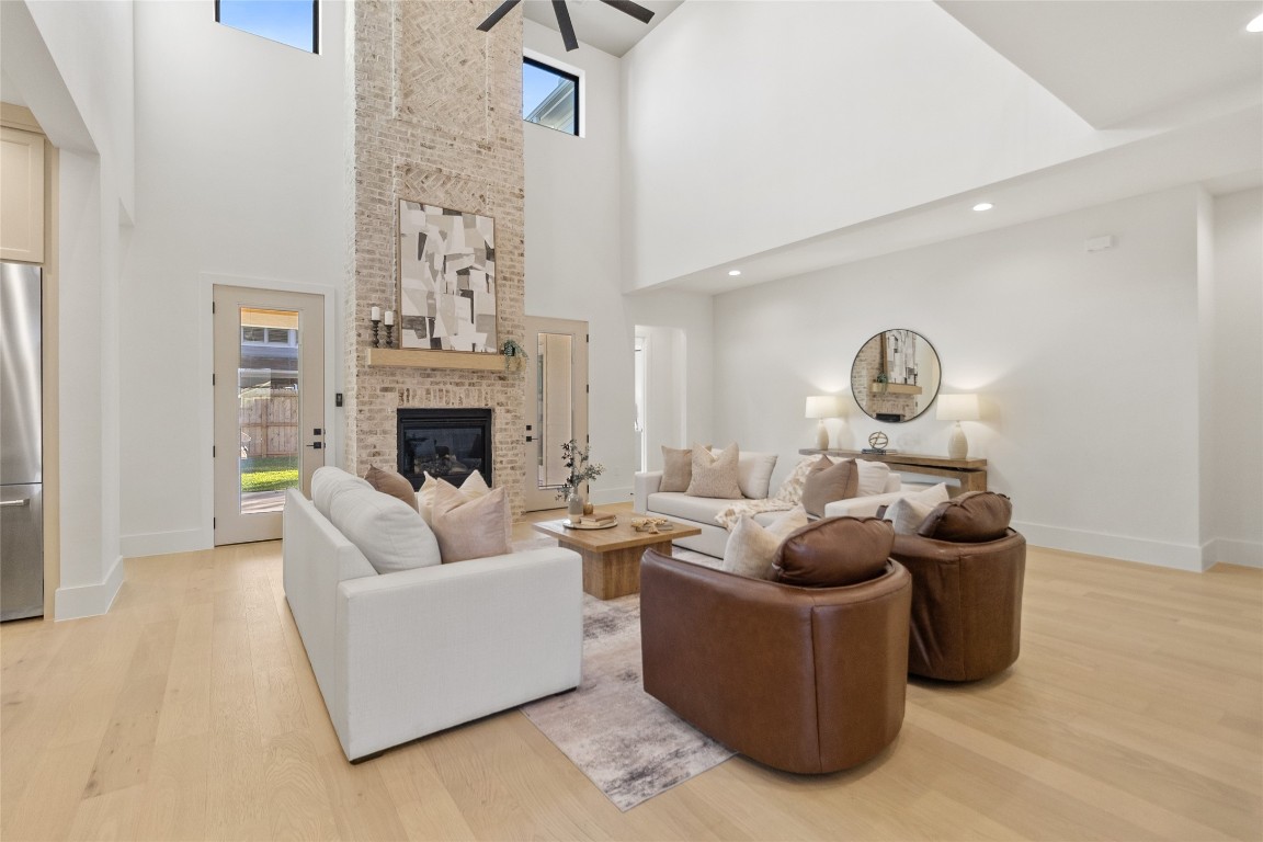 7115 Raton Street Houston, TX 77055 - Photo 38 of 49 This view highlights how seamlessly your indoor living extends outward, with glass doors and open circulation leading toward the backyard. It’s the kind of layout that makes gatherings flow naturally while still giving you defined, comfortable spaces to unwind.