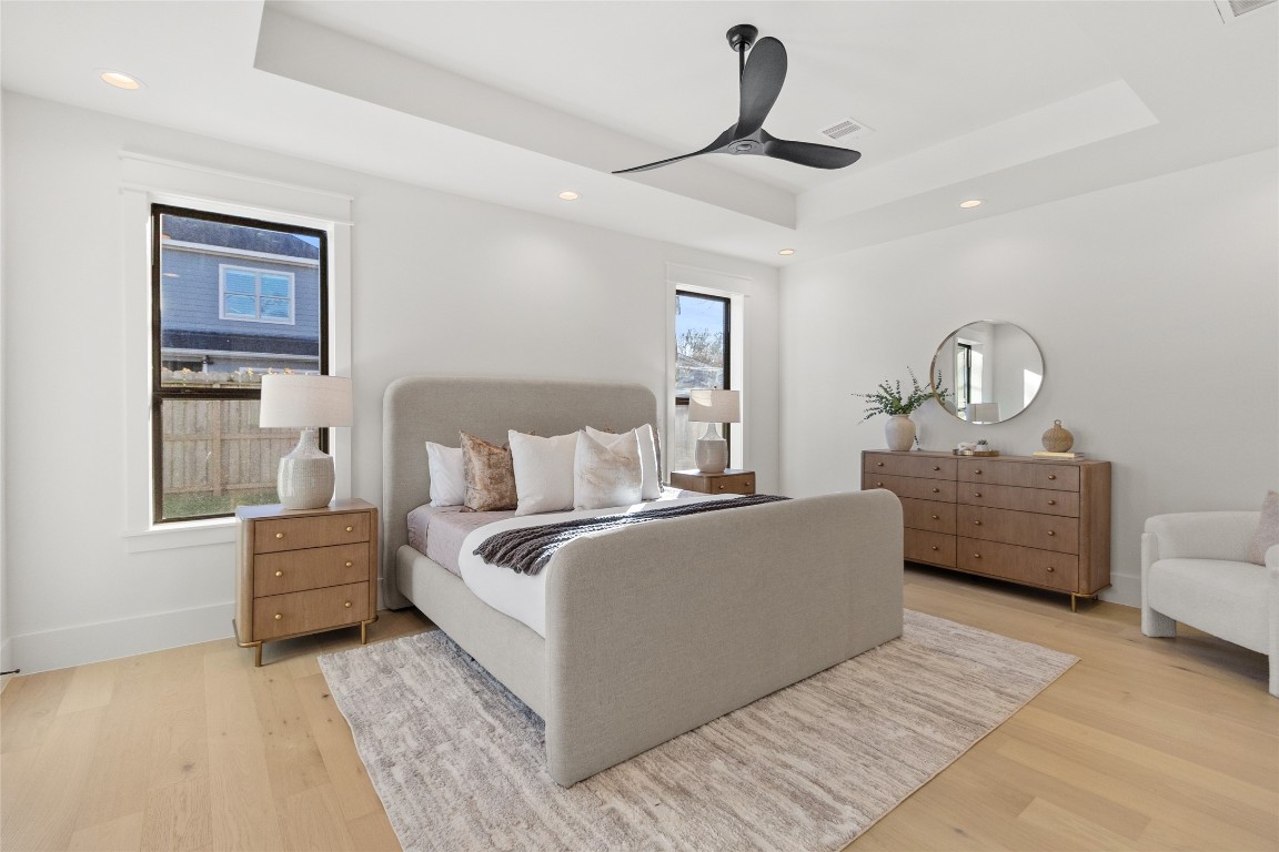 7115 Raton Street Houston, TX 77055 - Photo 39 of 49 This angle highlights just how airy and balanced the room feels, with soft natural light, wide-plank flooring, and a layout that gives you flexibility for seating, dressers, or a cozy reading corner. Every detail works together to create a space that feels calm, grounded, and undeniably comfortable.