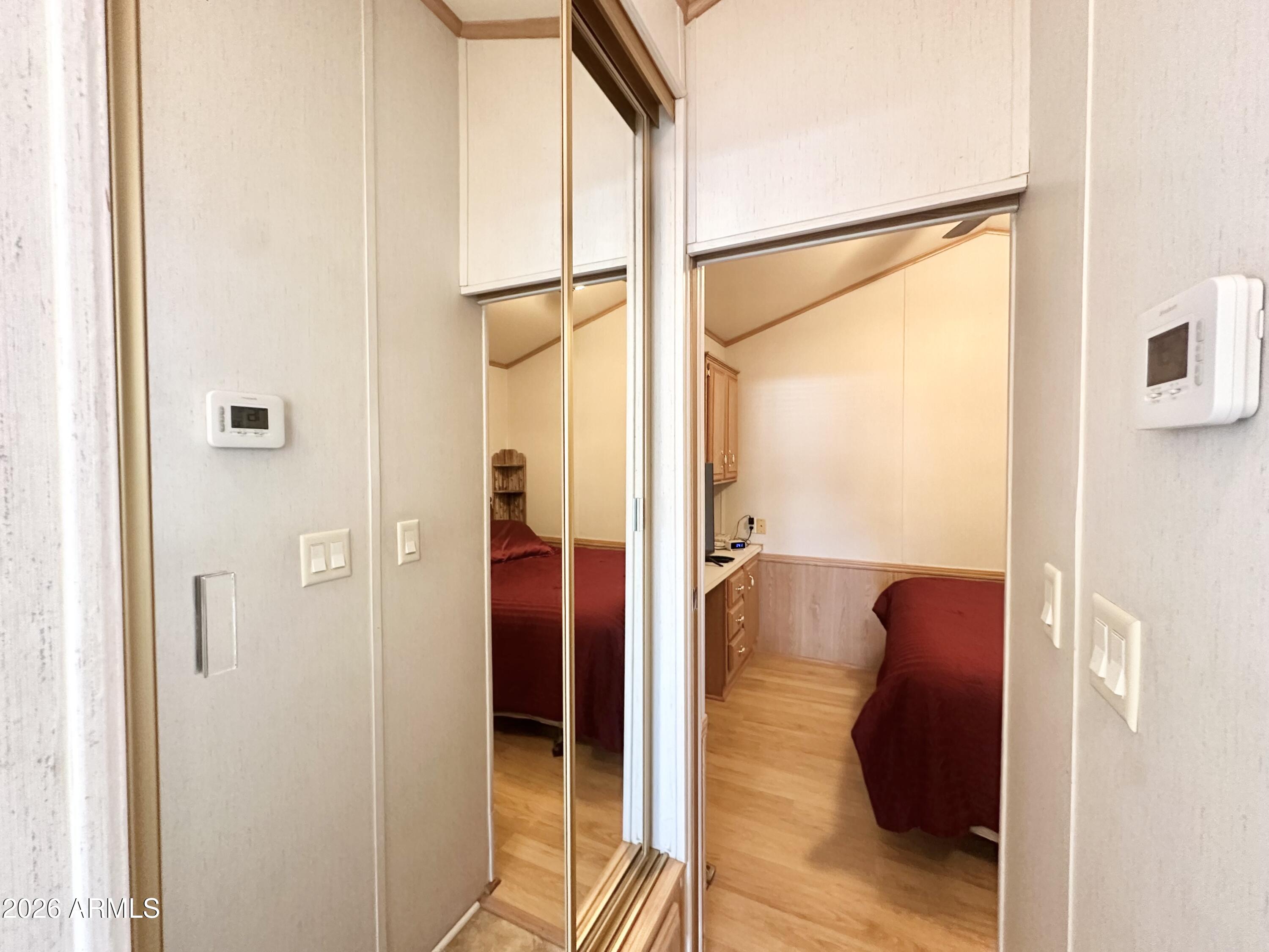 111 South Greenfield Road, Unit 809 Mesa, AZ 85206 - Photo 25 of 49 HALLWAY MIRRORED CLOSET