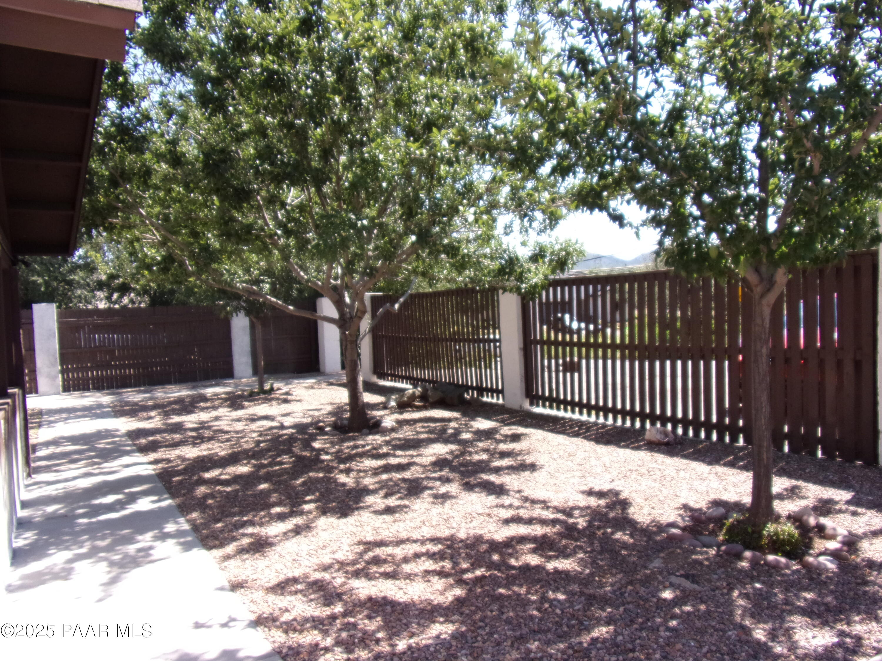 5280 Diamond Drive, Unit A Prescott, AZ 86301 - Photo 2 of 11 a view of a yard with a large tree