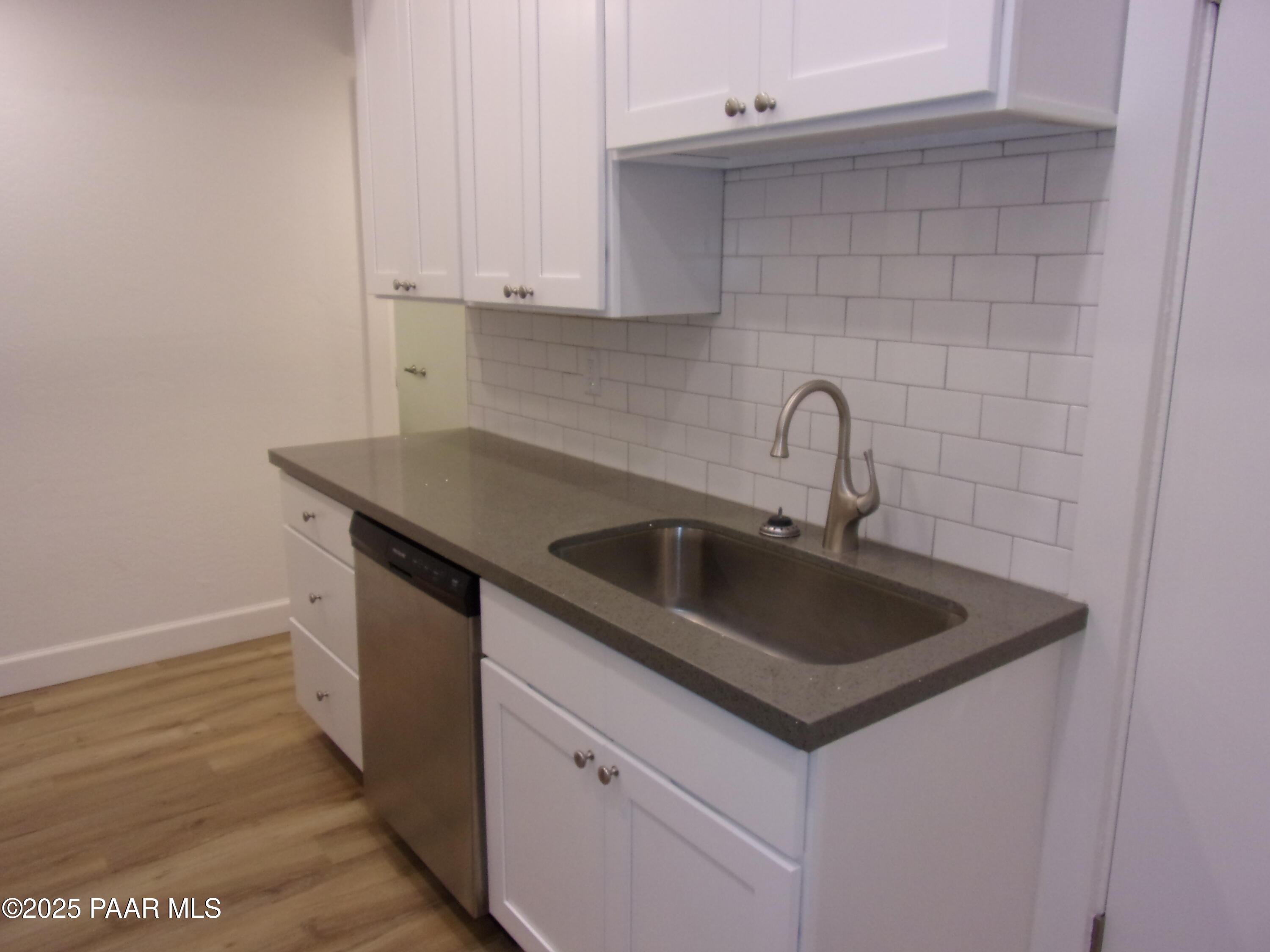 5280 Diamond Drive, Unit A Prescott, AZ 86301 - Photo 4 of 11 a kitchen with a sink and cabinets