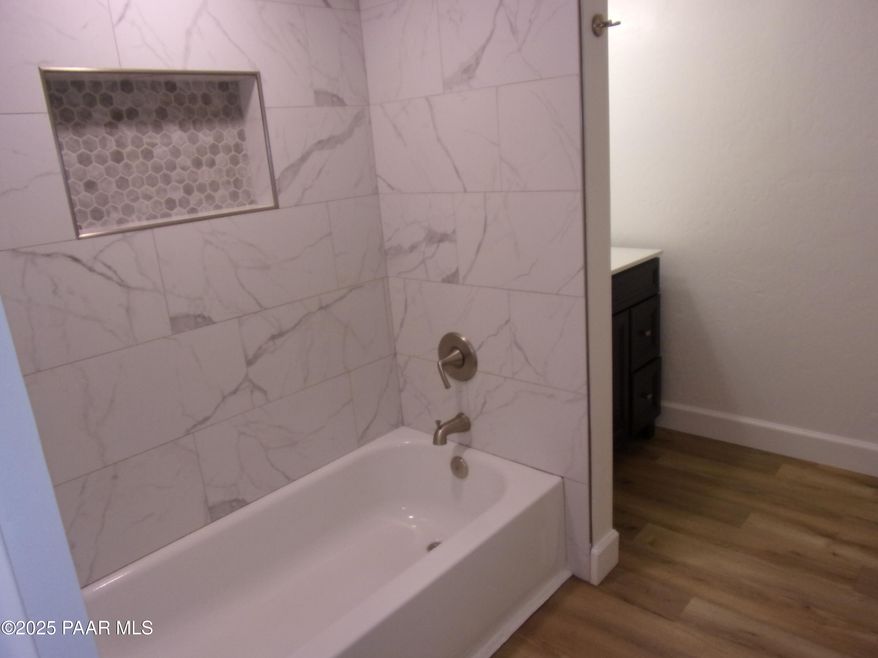 5280 Diamond Drive, Unit A Prescott, AZ 86301 - Photo 8 of 11 a bathroom with a bathtub