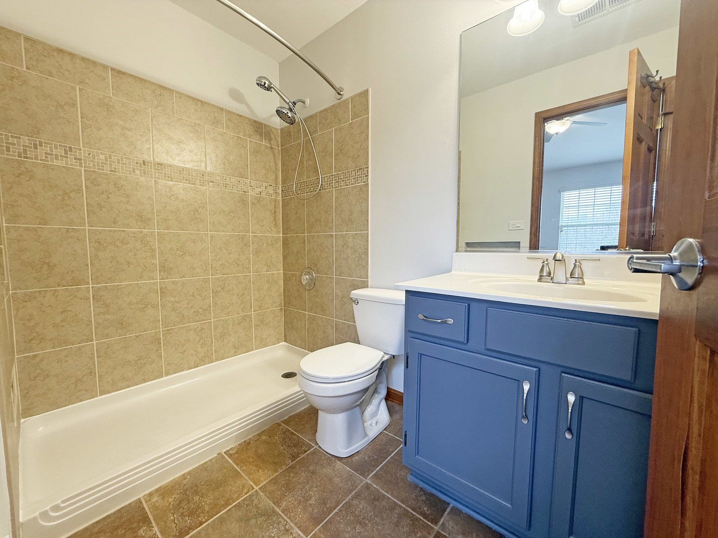 440 Mill Street Batavia, IL 60510 - Photo 13 of 17 a bathroom with a sink a toilet and shower