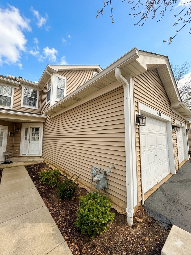 440 Mill Street Batavia, IL 60510 - Photo 2 of 17 a front view of a house with garden