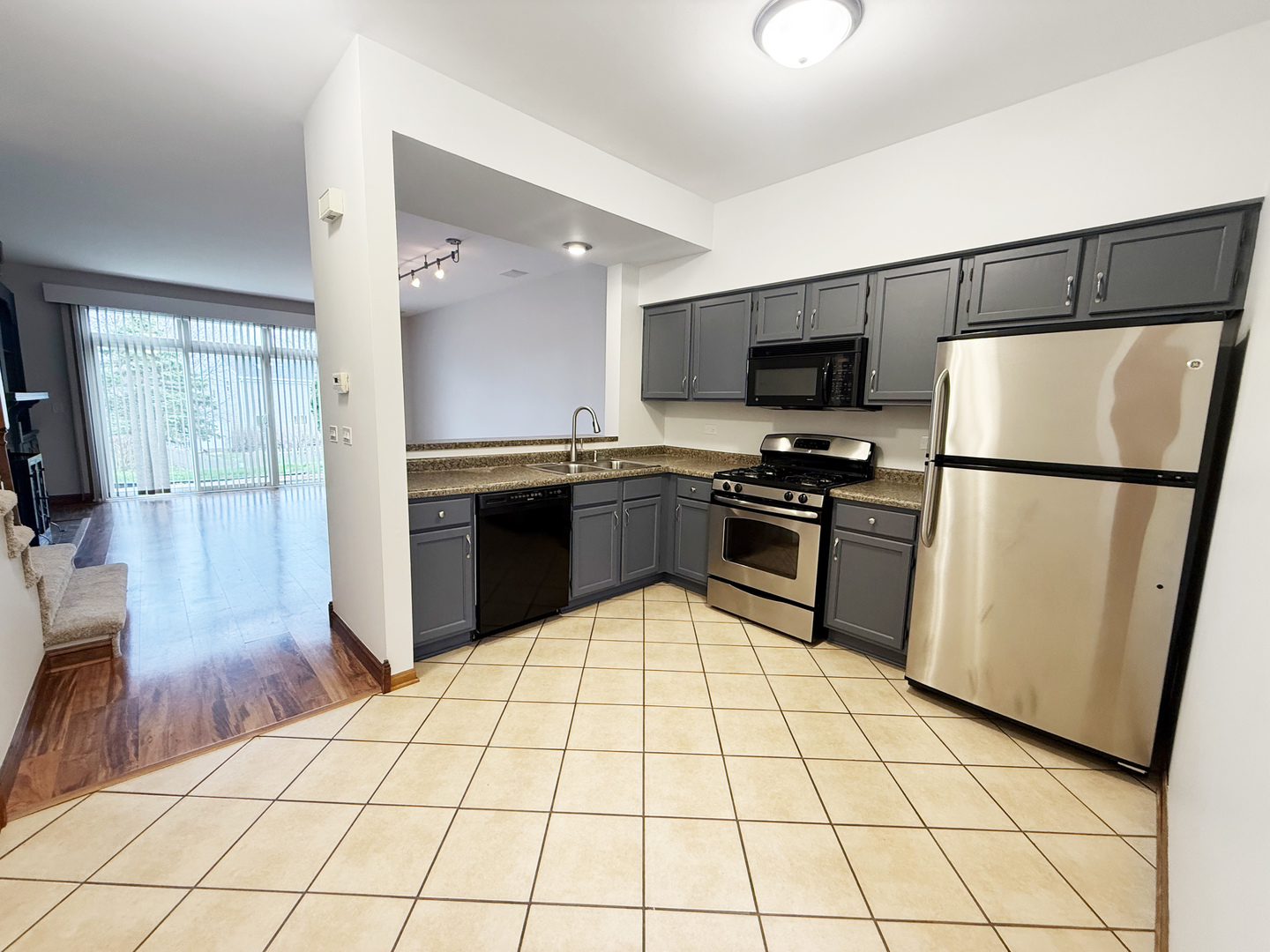 440 Mill Street Batavia, IL 60510 - Photo 3 of 17 a kitchen with stainless steel appliances a refrigerator sink and microwave