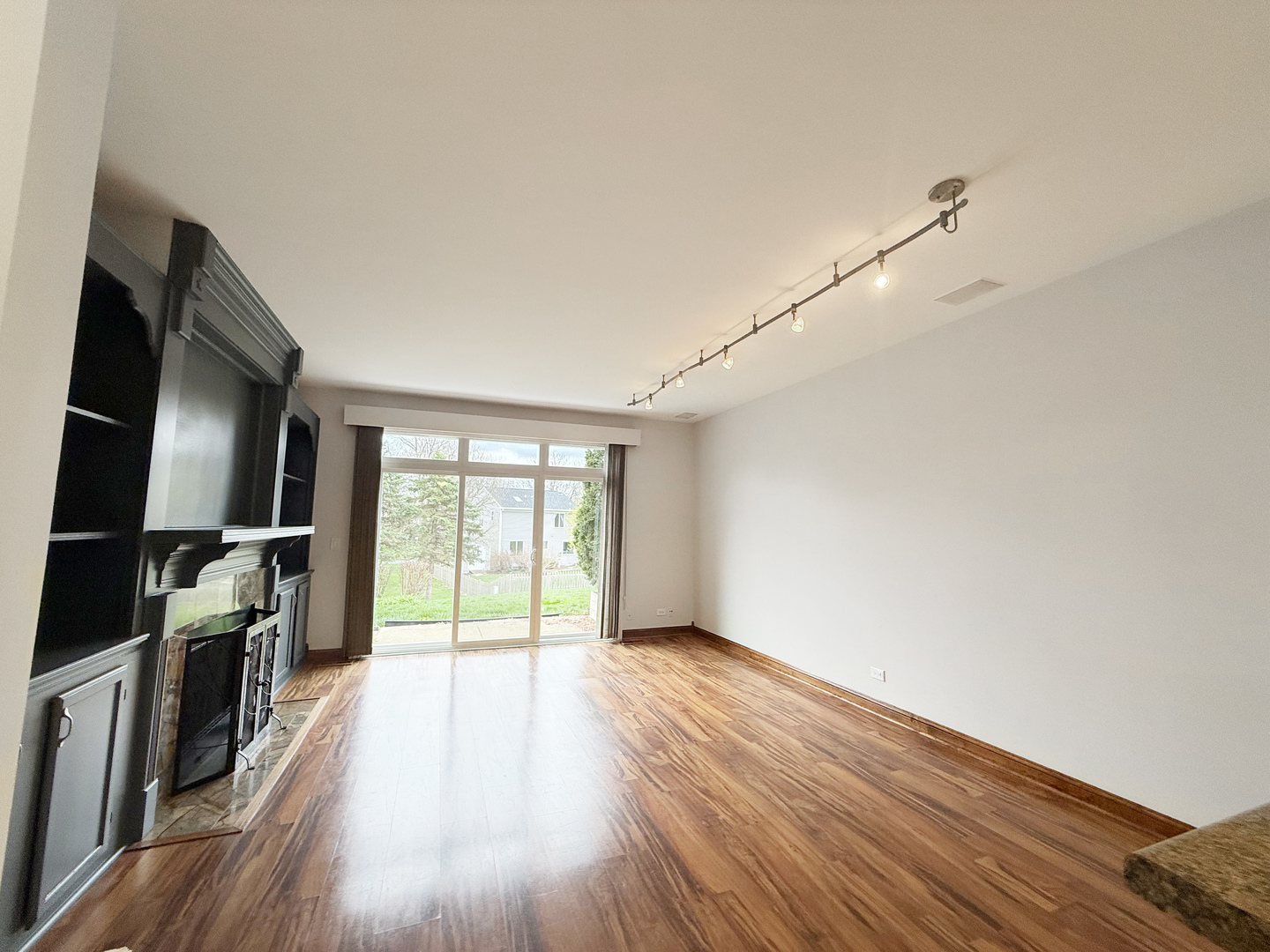 440 Mill Street Batavia, IL 60510 - Photo 8 of 17 a view of empty room with wooden floor and fan