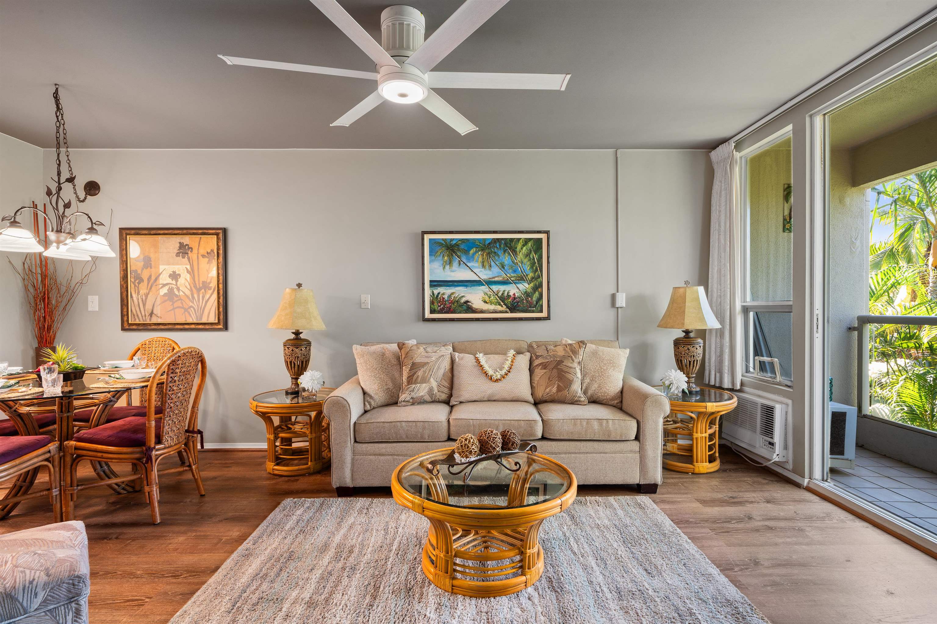 a living room with furniture a rug and a window