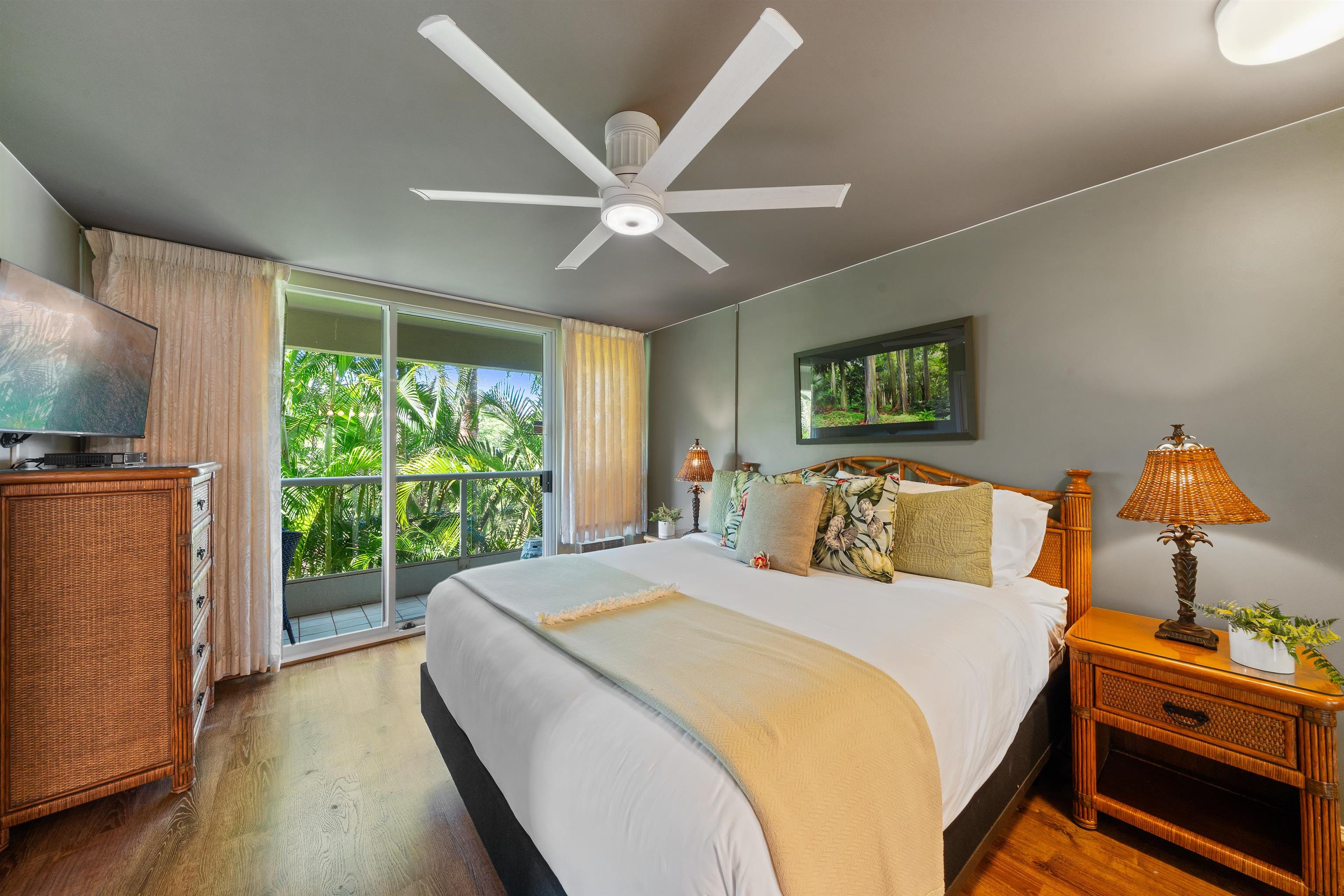 2575 South Kihei Road, Unit H207 Kihei, HI 96753 - Photo 5 of 31 a bed room with a bed and a chandelier