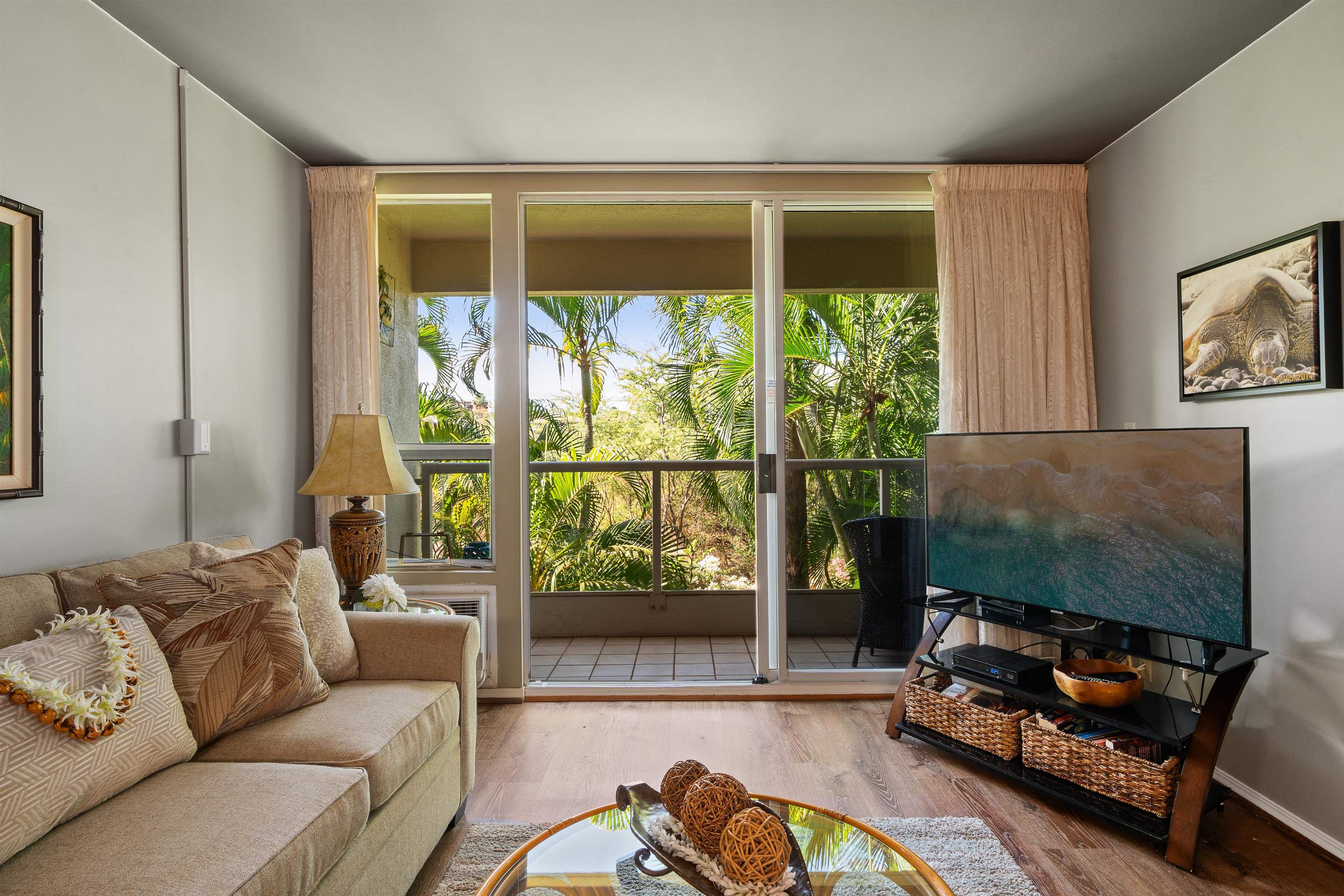2575 South Kihei Road, Unit H207 Kihei, HI 96753 - Photo 9 of 31 a living room with furniture and a flat screen tv