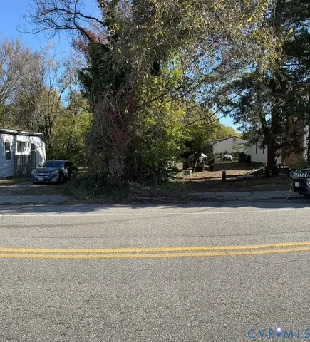 a view of street with a cars parked on road