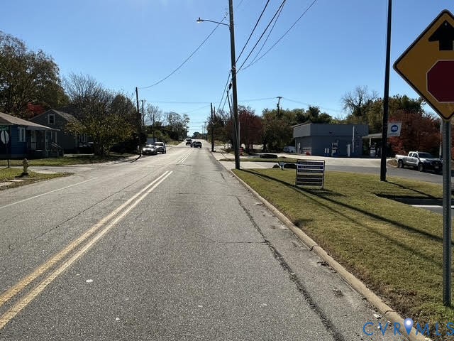 309 North Crater Road Petersburg, VA 23803 - Photo 4 of 5 a view of a street with houses on both side of it