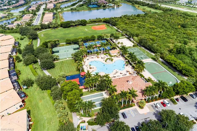 an aerial view of residential houses with outdoor space and street view