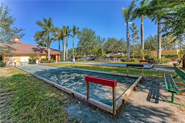 a view of a park with sitting area
