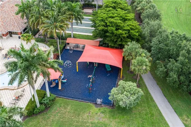 an aerial view of a house with swimming pool garden and patio